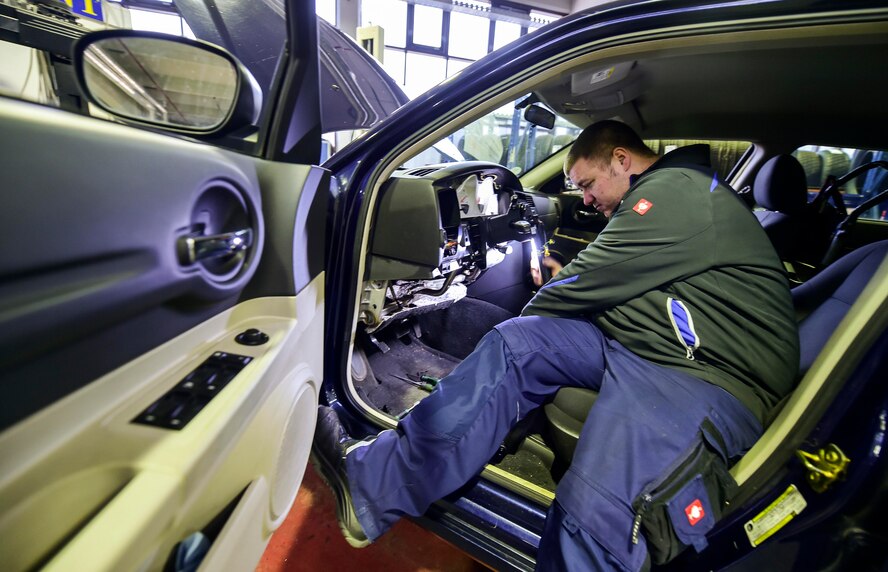 Dominic Pirron, 86th Vehicle Readiness Squadron vehicle maintenance apprentice, repairs the steering console of a government owned vehicle at Ramstein Air Base, Germany, Feb. 12, 2016. Pirron was employed through the apprentice program for nearly four years before being permanently hired by the 86th VRS. (U.S. Air Force photo/Staff Sgt. Sara Keller)