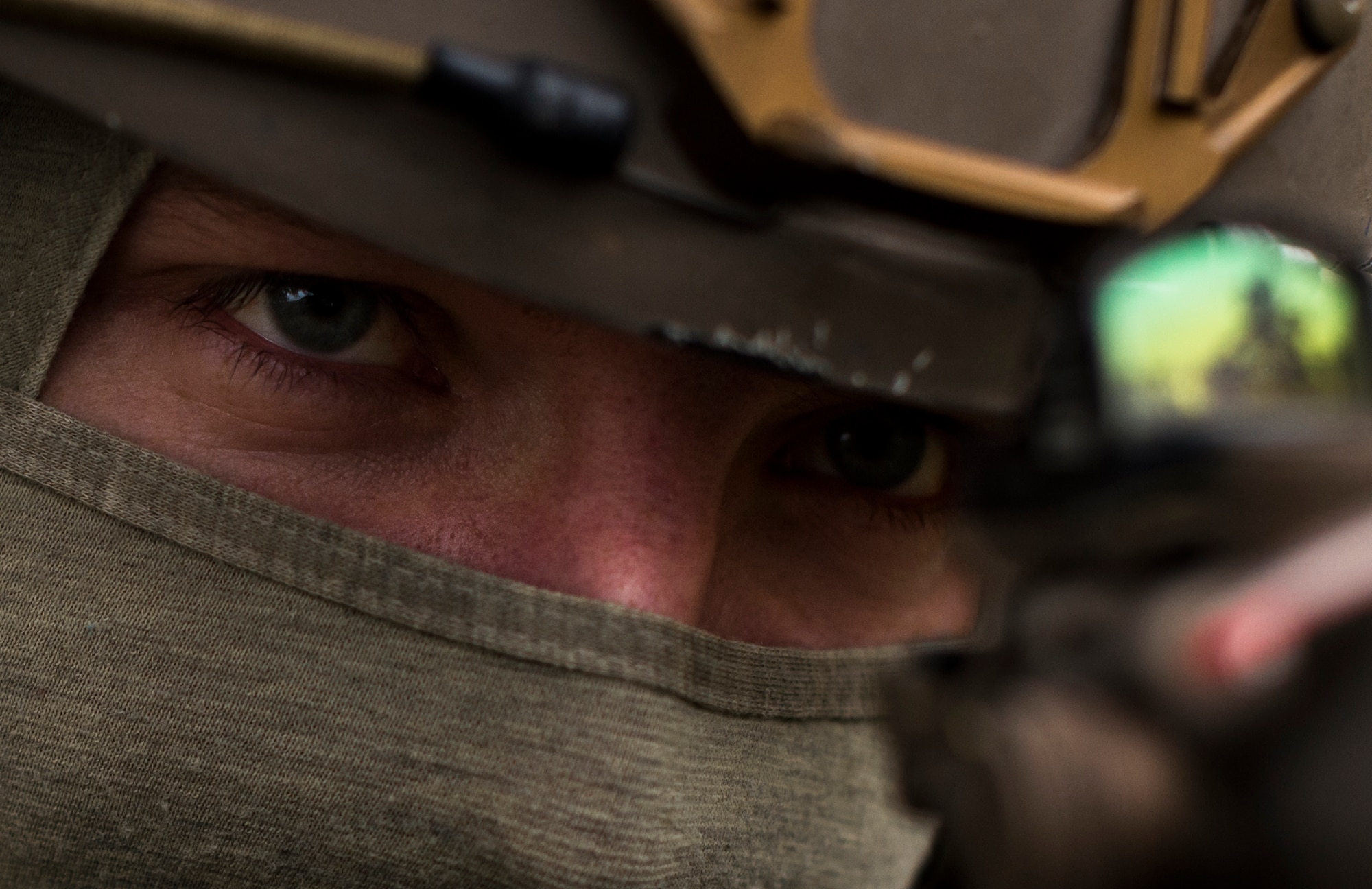 Senior Airman Martin Dietrich, 2nd Air Support Operations Squadron tactical air control party member, looks through the scope on his weapon during training at U.S. Army Garrison Bavaria in Vilseck, Germany, Feb. 8, 2016. The training consisted of Airmen calling in close air support, neutralizing opposing forces and practicing medical evacuation by helicopter. The role of an ASOS Airman is to be the subject matter expert on available air capabilities are for the ground commander. (U.S. Air Force photo/Senior Airman Jonathan Stefanko)