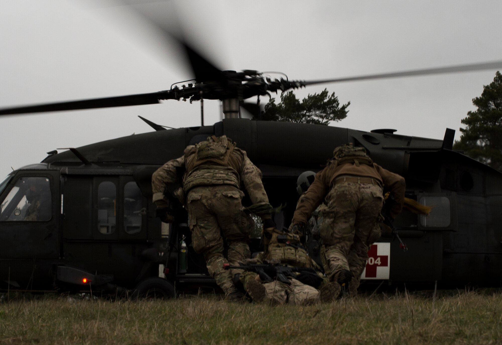 Airmen from the 2nd Air Support Operations Squadron, drag a simulated casualty for medical evacuation during training at U.S. Army Garrison Bavaria in Vilseck, Germany, Feb. 8, 2016. The training consisted of calling in close air support, neutralizing opposing forces and practicing medical evacuation by helicopter. Blank rounds and smoke grenades were used during the training to simulate the potential chaos an ASOS Airman may experience during a real world mission. (U.S. Air Force photo/Senior Airman Jonathan Stefanko)