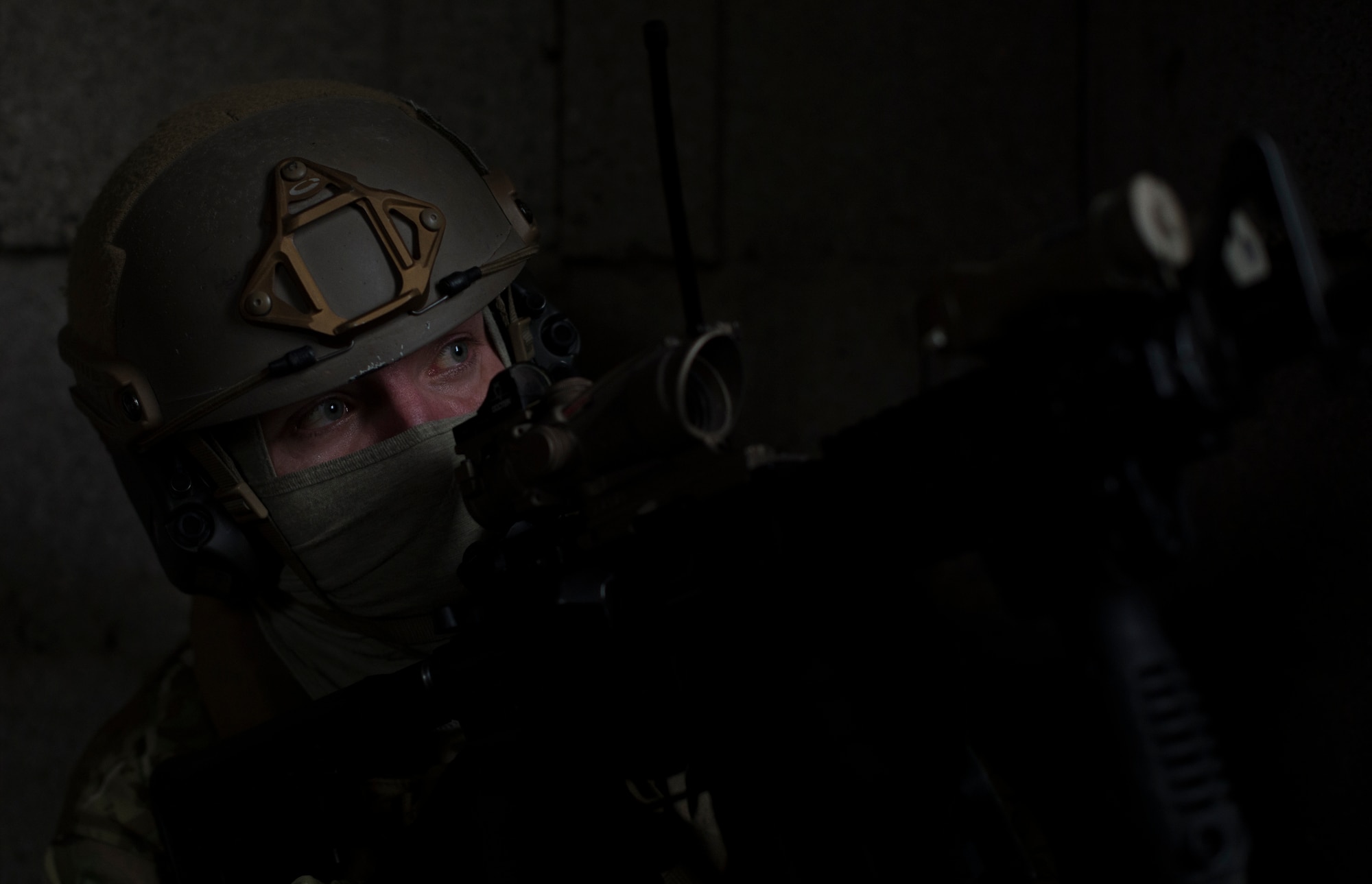 Senior Airman Martin Dietrich, 2nd Air Support Operations Squadron tactical air control ember, watches for opposing forces during training at U.S. Army Garrison Bavaria in Vilseck, Germany, Feb. 8, 2016. The training consisted of 2nd ASOS Airmen calling in close air support, neutralizing opposing forces and practicing medical evacuation by helicopter. By conducting the training in an urban environment the ASOS team was forced to think about proper tactics to ensure they weren’t caught in the line of fire. (U.S. Air Force photo/Senior Airman Jonathan Stefanko)