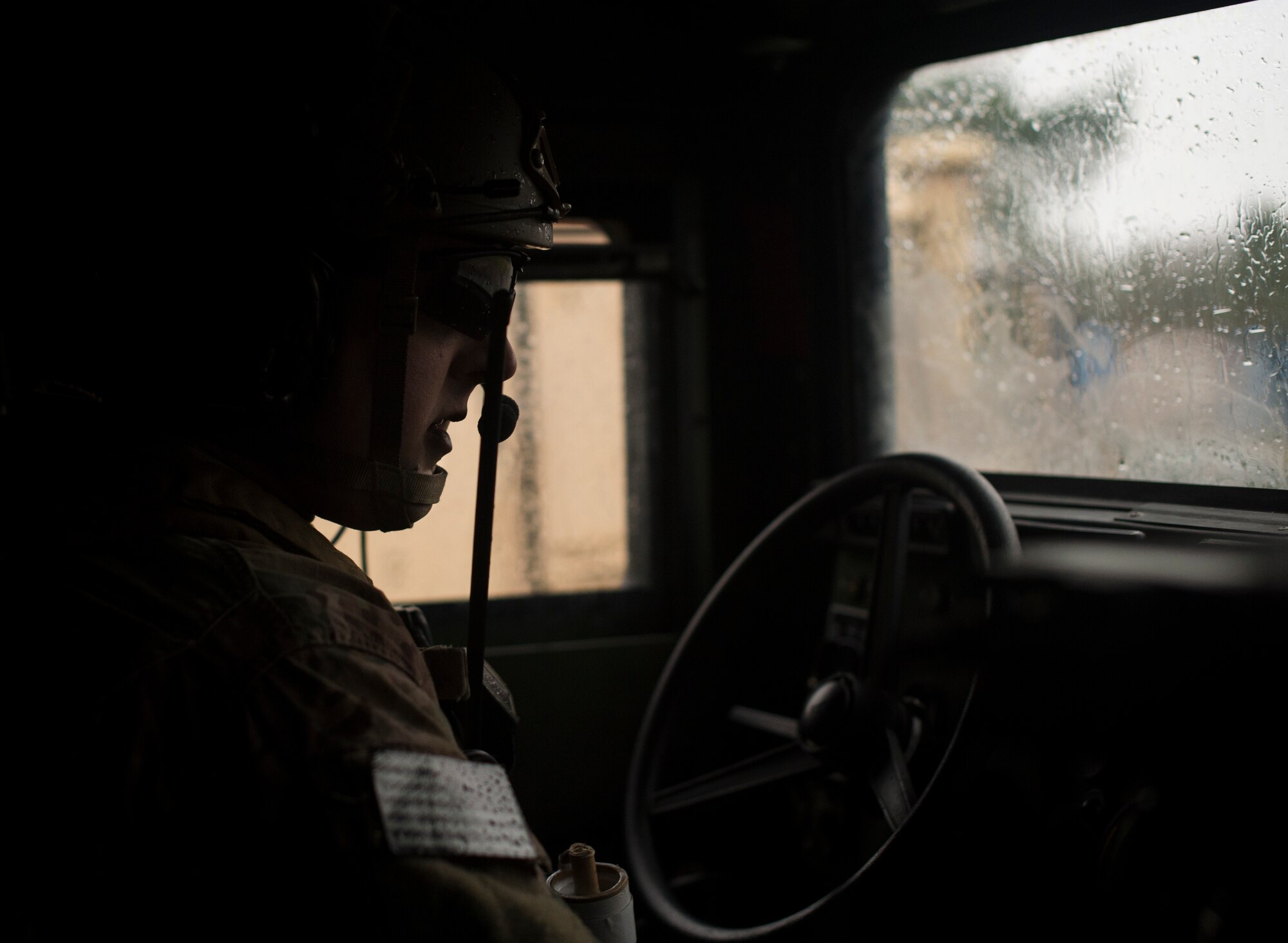 Senior Airman Logan Bennett, 2nd Air Support Operations Squadron joint terminal attack controller, drives through a simulated urban village during training at U.S. Army Garrison Bavaria in Vilseck, Germany, Feb. 9, 2016. The training consisted of 2nd ASOS Airmen calling in close air support, neutralizing opposing forces and practicing medical evacuation by helicopter. All ASOS Airmen begin their career as a tactical air control party. JTAC is a status earned after completing on-the-job training and thus qualified to call close air support. (U.S. Air Force photo/Senior Airman Jonathan Stefanko)
