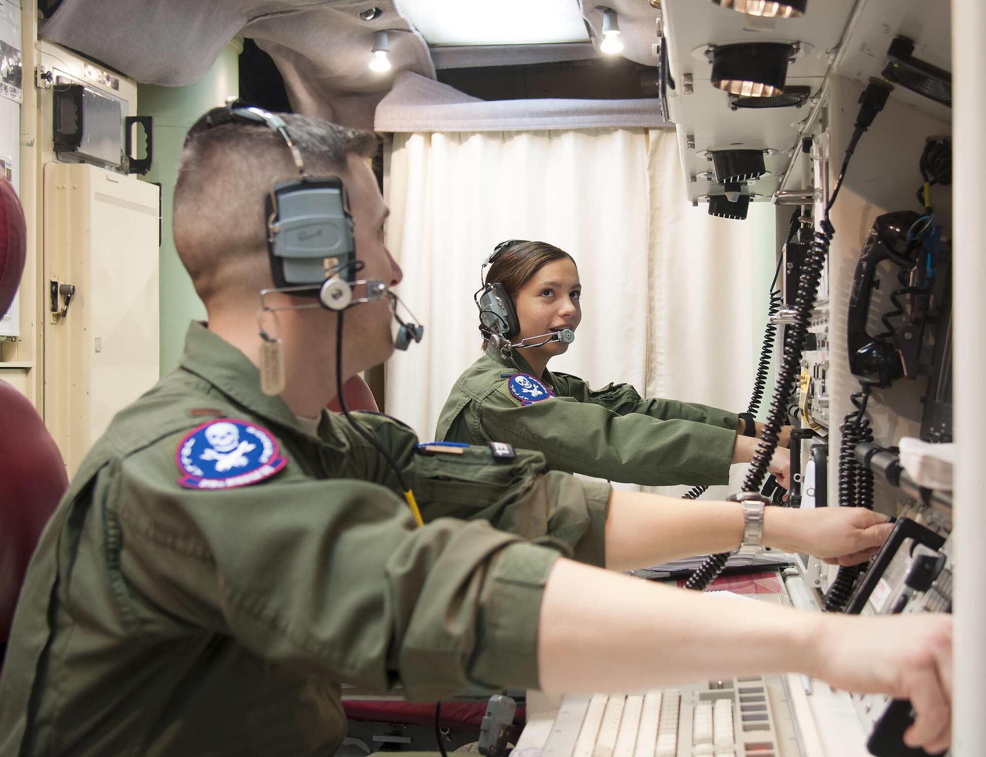 1st Lt. Pamela Blanco-Coca, 319th Missile Squadron missile combat crew commander, and her deputy commander, 2nd Lt. John Anderson, simulate key turns of the Minuteman III Weapon System Feb. 9, 2016, in a launch control center in the F.E. Warren Air Force Base, Wyo., missile complex. When directed by the U.S. President a properly conducted key turn sends a "launch vote" to any number of Minuteman III ICBMs in a missileer's squadron, with two different launch votes enabling a launch. (U.S. Air Force photo by Senior Airman Jason Wiese)