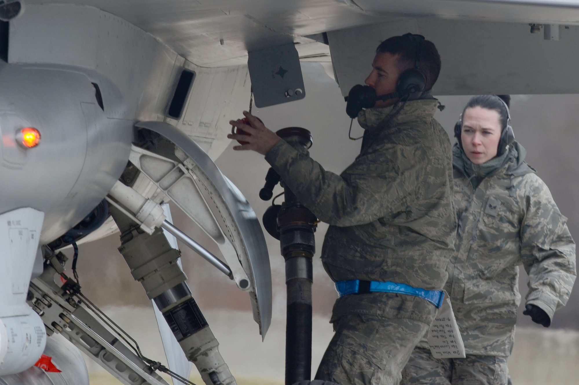 U.S. Air Force Staff Sgt. Charles Yetton, a crew chief assigned to the 169th Aircraft Maintenance Squadron of the South Carolina Air National Guard, disconnects a fuel hose from an F-16 Fighting Falcon fighter jet during “hot-pit” ground refueling training on the flight line at McEntire Joint National Guard Base, S.C., Feb. 7, 2016.  Ground refueling while the engine is running, allows aircraft to return to flight quickly during sortie operations and combat missions. (U.S. Air National Guard photo by Senior Airman Ashleigh S. Pavelek))