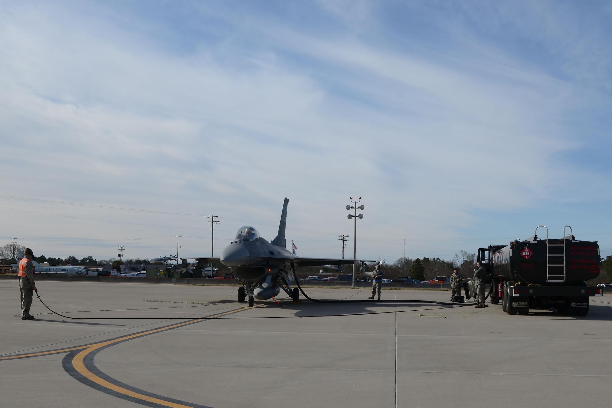 U.S. Air Force Airmen of the 169th Logistics Readiness Squadron and the 169th Aircraft Maintenance Squadron refuel two F-16 fighting falcon fighter jets during “hot-pit” ground refueling training on the flight line at McEntire Joint National Guard Base, S.C., Feb. 6, 2016.  Ground refueling, while the engine is running allows aircraft to return to flight quickly during sortie operations and combat missions. (U.S. Air National Guard photo by Senior Airman Ashleigh S. Pavelek)