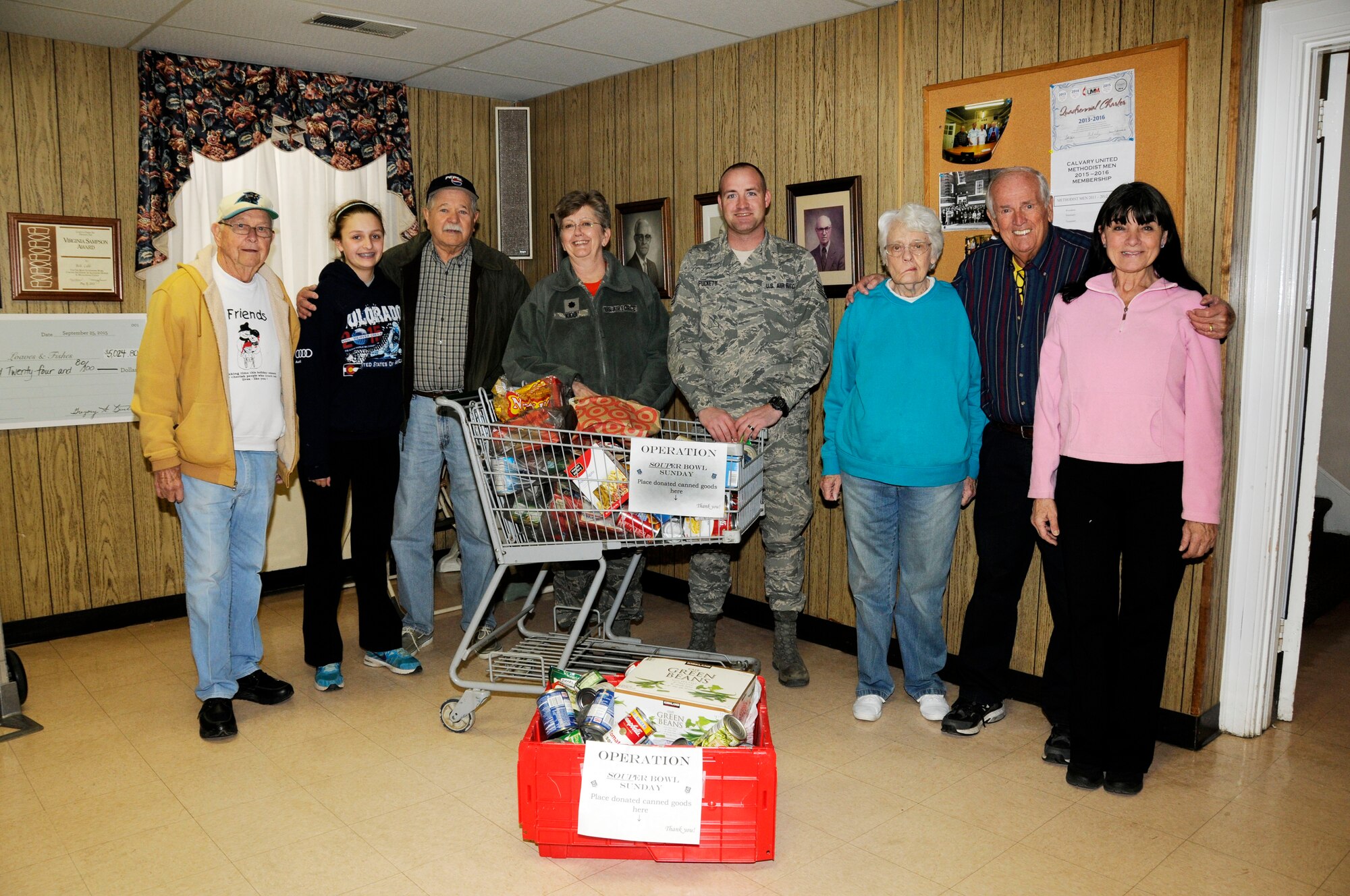 U.S. Air Force Tech. Sgt. Dennis Puckett and 145th Wing Chaplain (Lt. Col.) Debra Kidd from the North Carolina Air National Guard, stand with volunteers after dropping off food items at the Loaves and Fishes food pantry in Charlotte, N.C., Feb. 12, 2016. During February’s Unit Training Assembly, Airmen celebrated the Carolina Panthers and Super Bowl Sunday by participating in “Souper” Bowl. “Souper Bowl of Caring” utilizes Super Bowl weekend to rally people together in an effort to help fight hunger and poverty in their local communities. (U.S. Air National Guard photo by Master Sgt. Patricia F. Moran/Released)