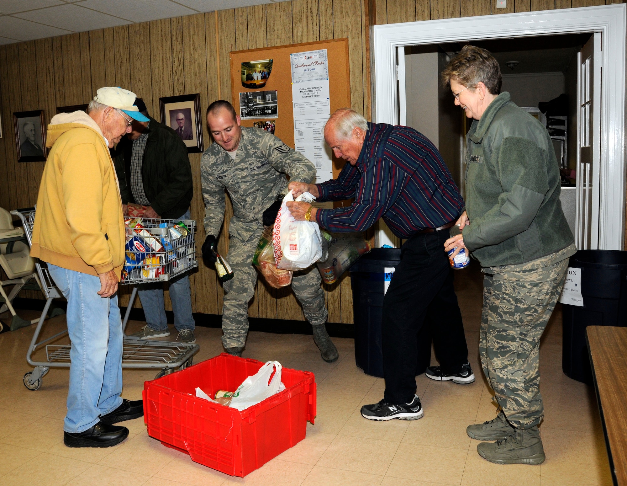 U.S. Air Force Tech. Sgt. Dennis Puckett and 145th Wing Chaplain (Lt. Col.) Debra Kidd from the North Carolina Air National Guard, get help from volunteers as they dropped off food items at Loaves and Fishes food pantry in Charlotte, N.C., Feb. 12, 2016. During February’s Unit Training Assembly, Airmen celebrated the Carolina Panthers and Super Bowl Sunday by participating in “Souper” Bowl. “Souper Bowl of Caring” utilizes Super Bowl weekend to rally people together in an effort to help fight hunger and poverty in their local communities. (U.S. Air National Guard photo by Master Sgt. Patricia F. Moran/Released)