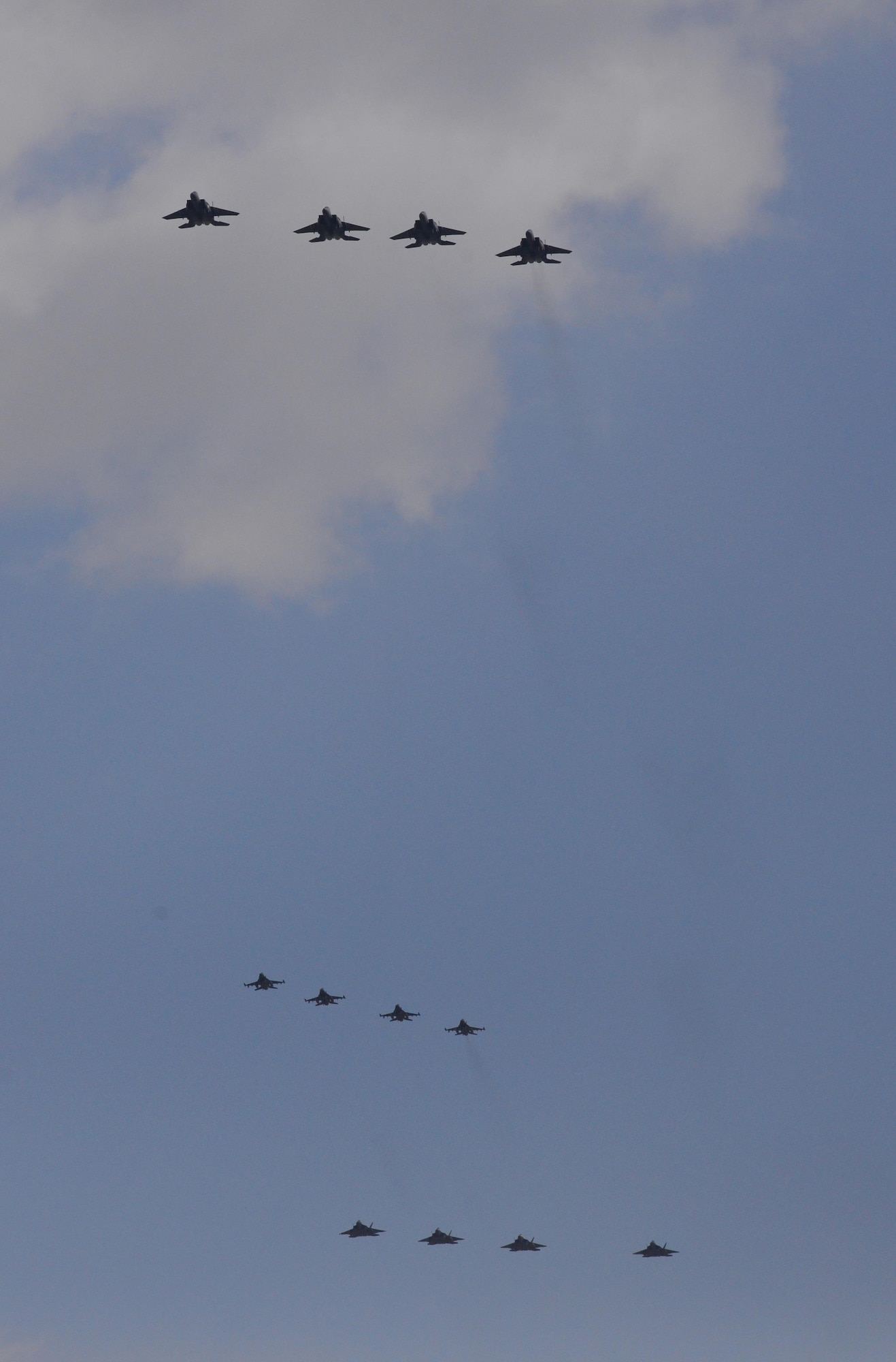 Four U.S. Air Force F-22 "Raptor" fighter aircraft from Kadena Air Base, Japan, conducted a flyover in the vicinity of Osan Air Base, South Korea, in response to recent provocative action by North Korea Feb. 17, 2016. The Raptors were joined by four F-15 Slam Eagles and U.S. Air Force F-16 Fighting Falcons. The F-22 is designed to project air dominance rapidly and at great distances and currently cannot be matched by any known or projected fighter aircraft.  
(U.S. Air Force photo by Staff Sgt. Amber Grimm/Released)