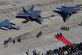 A U.S. Air Force F-22 Raptor from Kadena Air Base, Japan, is flanked by an F-16 Fighting Falcon and a South Korean air force F-15K Slam Eagle at Osan Air Base, South Korea, Feb. 17, 2016. The Raptor was part of a flyover formation of 12 aircraft demonstrating the strength of the U.S.-South Korea alliance in response to recent provocative actions by North Korea. (U.S. Air Force photo/Staff Sgt. Amber Grimm)
