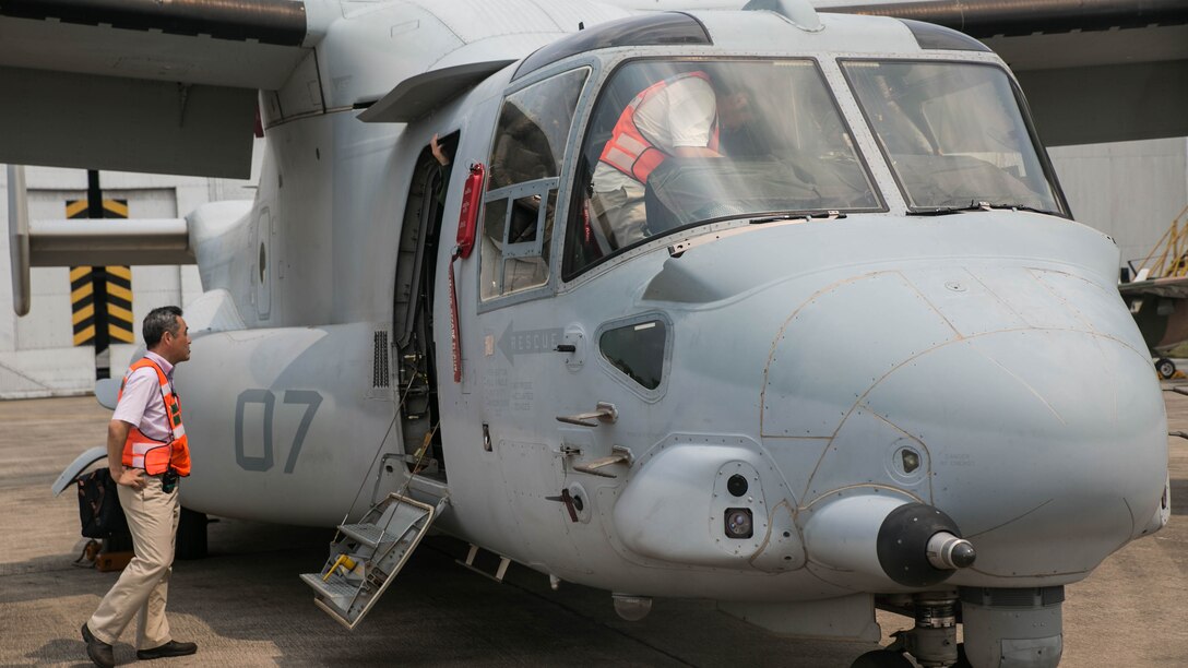 Japanese observers tour and examine a MV-22 Osprey during a noncombatant evacuation demonstration as part of exercise Cobra Gold 16 at Utapao, Thailand, February 17, 2016. U.S. Marines put an Osprey on static display during the demonstration while partner nations exercised their own evacuation capabilities. The Osprey provides a longer flight range and a bigger capacity for supplies compared to traditional helicopters, but allows service members to access smaller areas compared to traditional fixed-wing aircraft. Cobra Gold, in its 35th iteration, is a multi-national exercise designed to advance regional security and ensure effective responses to regional crises by bringing together a robust combined task force from partner nations sharing common goals and security commitments in the Asia-Pacific region. The Osprey is with Marine Medium Tiltrotor Squadron 262, Marine Aircraft Group 36, 1st Marine Aircraft Wing, III Marine Expeditionary Force.