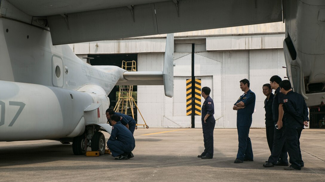 A group of Royal Thai service members inspect a MV-22 Osprey during a noncombatant evacuation demonstration as part of exercise Cobra Gold 16 at Utapao, Thailand, February 17, 2016. During the demonstration U.S. Marines set up an Osprey for partner nations to view and tour while the other services exercised noncombatant evacuation capabilities. The Osprey brings a combination of fixed-wing and traditional rotor aircraft to the toolbox during a natural disaster or evacuation type situation. Cobra Gold is a multi-national exercise designed to advance cooperation capabilities between participating nations and preserve and promote peace in the Asia-Pacific region. The Osprey is with Marine Medium Tiltrotor Squadron 262, Marine Aircraft Group 36, 1st Marine Aircraft Wing, III Marine Expeditionary Force. 