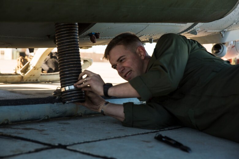Sgt. Benjamin Hebert, a crew chief with Marine Light Attack Helicopter Squadron 469 (HMLA-469) based out of Marine Corps Air Station Camp Pendleton, Calif., performs maintenance on a UH-1Y “Venom” helicopter aboard Marine Corps Air Station Yuma, Ariz., Friday, Feb. 5, 2016.