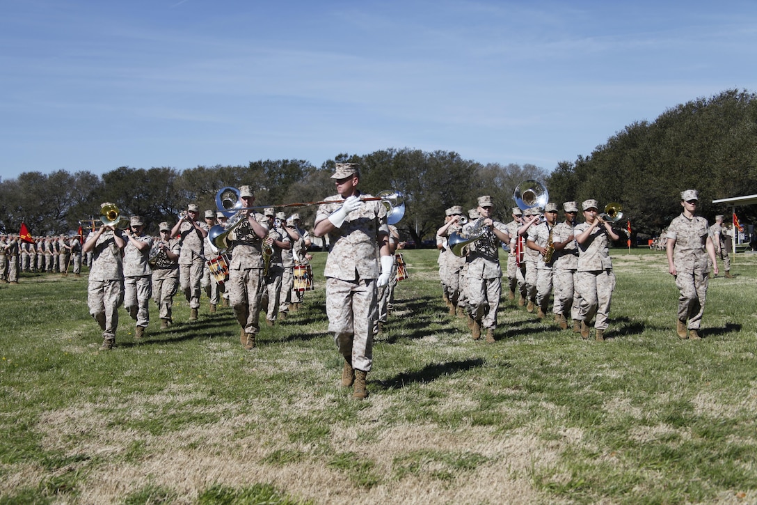 U.S. Marines with the 2nd Marine Division Band march during a post and relief ceremony aboard Naval Station Norfolk, Va., April 2, 2015. Sgt. Maj. William Frye relinquished his duties as the Regimental Sgt. Maj. of the Marine Corps Security Force Regiment to Sgt. Maj. Darby Noonan during a post and relief ceremony. (U.S. Marine Corps photo by Sgt. Esdras Ruano/Released)