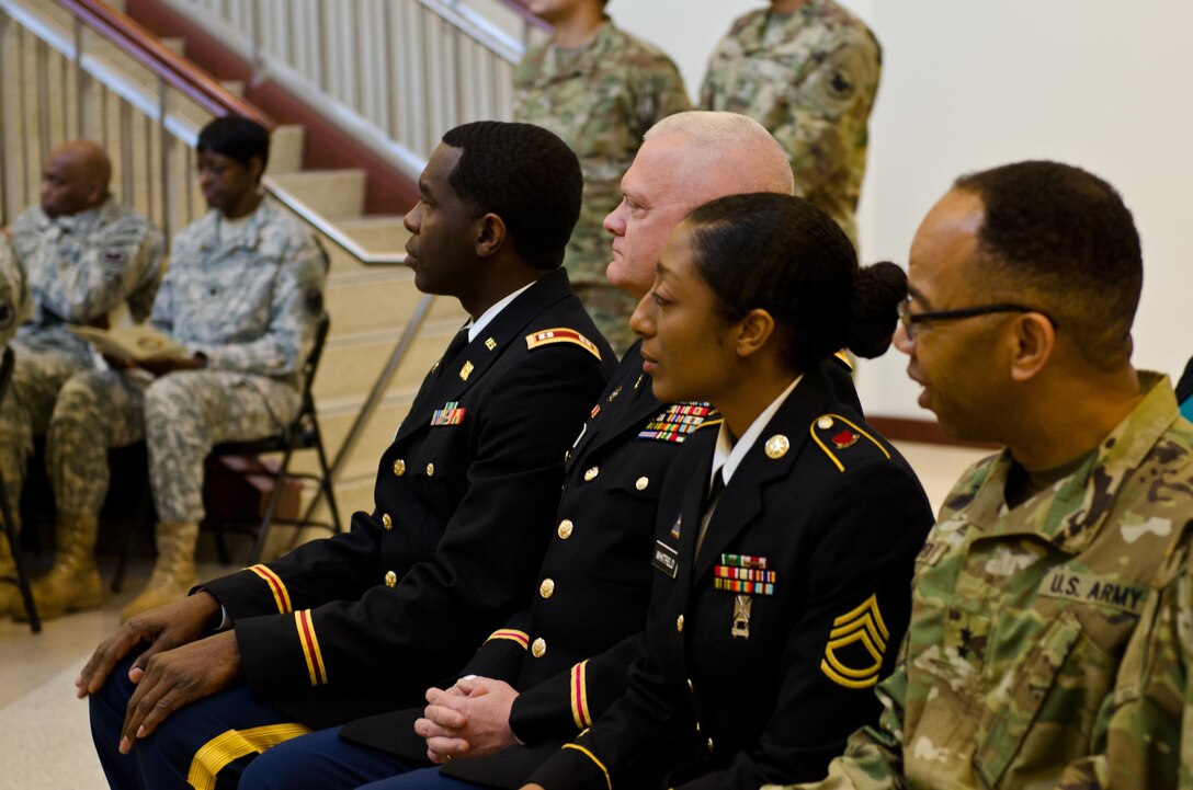 The 2015 U.S. Army Reserve Instructor of the Year recipients, Capt. Edgar Borgella, assigned to the 83rd U.S. Army Reserve Readiness Training Center; Chief Warrant Officer 4 David Griffin, also with the 83rd USARRTC; and Sgt. 1st Class JaDrian A. Whitfield, with the 80th Training Command, listen attentively to guest speakers at the U.S. Army Reserve Command headquarters, Feb. 11, 2016. Each instructor, representing the noncommissioned  officer, warrant officer, and officer category, were honored in the first USARC hosted Instructor of the Year Ceremony. The Training and Doctrine-U.S. Army Reserve Instructor of the Year winner will be announced April 8, 2016. (U.S. Army Reserve photo by Brian Godette, USARC Public Affairs)
