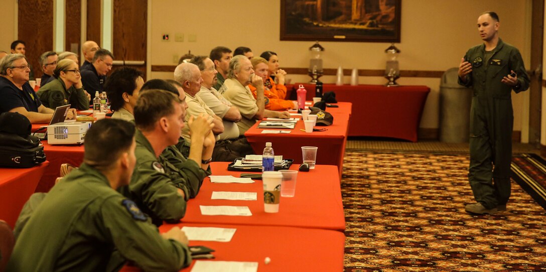 Maj. Patrick DeGraaf, the Search and Rescue (SAR) officer-in-charge with Headquarters & Headquarters Squadron, leads a discussion at the Sonoran Pueblo banquet hall as part of a SAR conference aboard Marine Corps Air Station Yuma, Ariz., Friday, Feb. 12, 2016. The MCAS Yuma SAR team hosted a conference with regional emergency services personnel to discuss and better understand tactics, techniques and procedures.