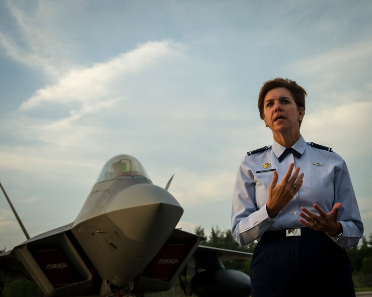 Gen. Lori J. Robinson, Pacific Air Forces commander, addresses U.S. and Singapore Airmen in front of an F-22A Raptor during the Singapore International Airshow, at Changi International Airport Singapore, Feb. 17, 2016. Robinson said that the Raptor’s presence at the show showcases the U.S. Air Force’s unique capability to rapidly mobilize fifth generation fighters throughout the Indo-Asia-Pacific region. (U.S. Air Force photo by Capt. Raymond Geoffroy/Released)