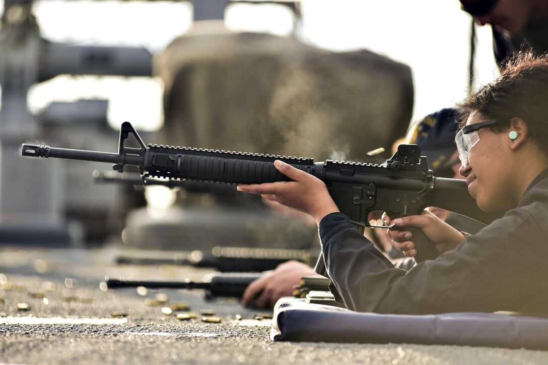 Navy Seaman Zahra Barabino fires an M16 rifle during small arms qualification training aboard the USS Ross in the Atlantic Ocean, Feb. 10, 2016. The Ross is conducting a routine patrol to support U.S. national security interests in Europe. Navy photo by Petty Officer 2nd Class Justin Stumberg