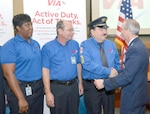 Brig. Gen. Bob LaBrutta (right), 502nd Air Base Wing and Joint Base San Antonio commander, thanks VIA bus and van operators (from left) Shantella Williams, Jeffery Wishert and Jesse Quintero, who were featured in the “Active Duty, Active of Thanks” campaign. VIA’s extension of their P4 will offer reduced rates, allowing all active duty members to ride VIA transportation at half-price fares throughout San Antonio or for a special monthly rate.