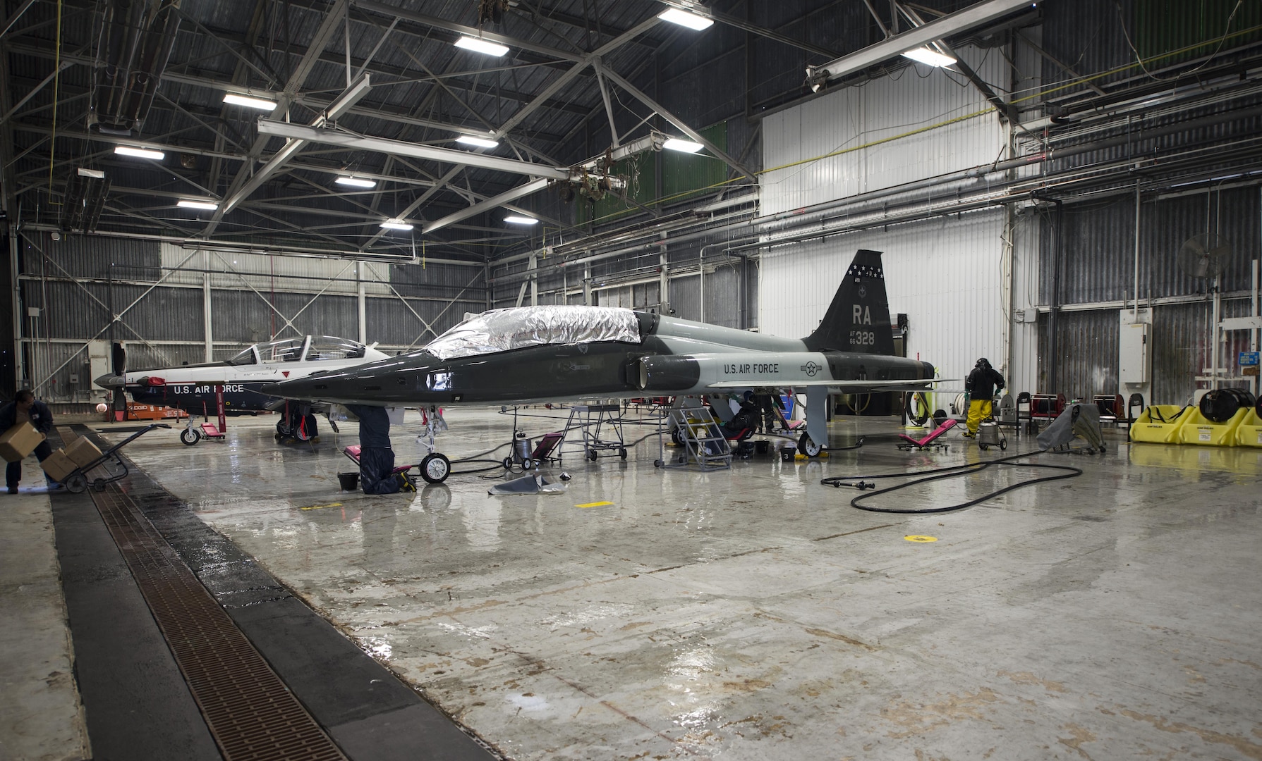 Members of the 12th Flying Training Wing Maintenance Directorate wash a T-38 Talon Feb. 2 at the new wash rack inside Hangar 42 at Joint Base San Antonio-Randolph. The 14-member corrosion control team now has its own indoor wash rack in Hangar 42 with benefits that include washes unimpeded by weather conditions and an environmentally friendly water-recycling system that conserves water, saving the Air Force $174,000 per year.