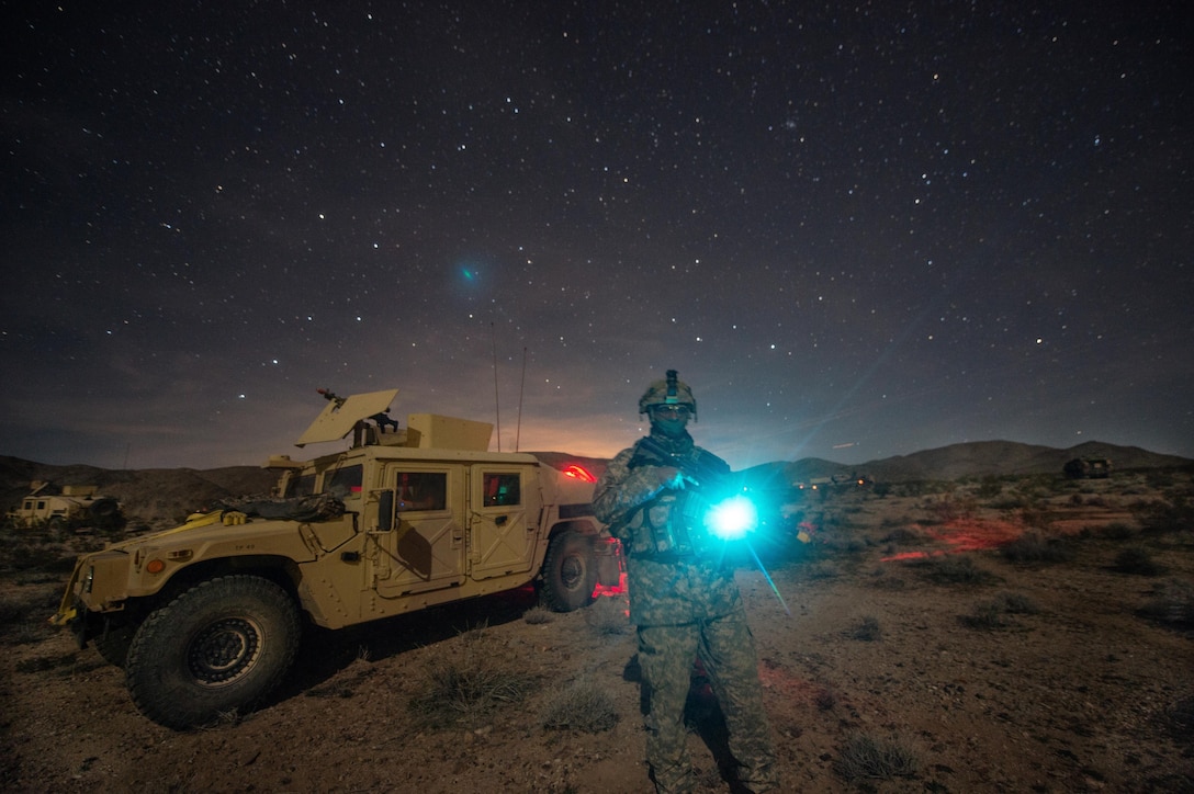 A U.S. Army civil affairs Soldier attached to 3rd Cavalry Regiment conducts security during a convoy halt at the National Training Center, Fort Irwin, Calif., Feb. 12, 2016. The National Training Center conducts tough, realistic, training to prepare brigade combat teams and other units for combat. (U.S. Army photo by Staff Sgt. Alex Manne/Released)