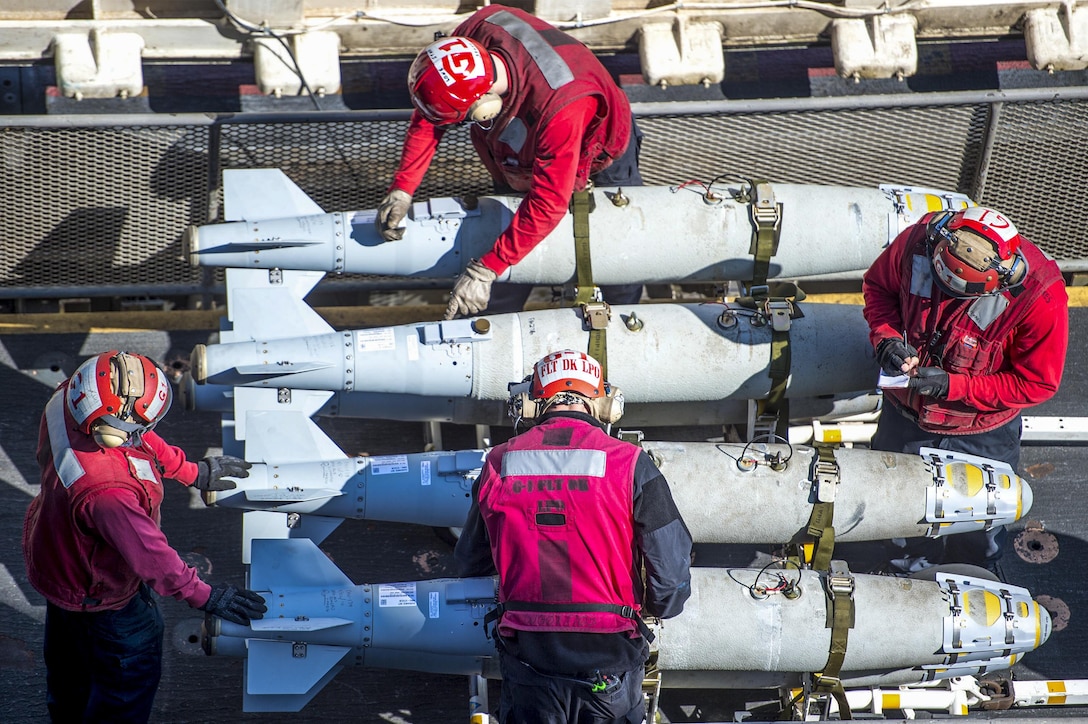 Sailors inspect ordnance on the flight deck of the USS Harry S. Truman in the Arabian Sea, Feb. 13, 2016. The Harry S. Truman Carrier Strike Group is supporting Operation Inherent Resolve and other security efforts in the U.S. 5th Fleet area of responsibility. Navy photo by Petty Officer 3rd Class J. M. Tolbert