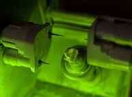 Raw material is milled in to a crown at Barksdale Air Force Base, La., Feb. 12, 2016. By using a series of precise calculations and measurements the milling machine created a crown from the material in 18 minutes. (U.S. Air Force photo/Airman 1st Class Mozer O. Da Cunha) 