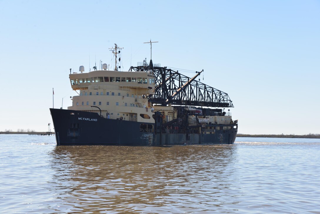 Feb. 16 - The Hopper Dredge McFarland works to keep the deep draft channel open in the lower Mississippi River. (Photo by the USACE, New Orleans District)