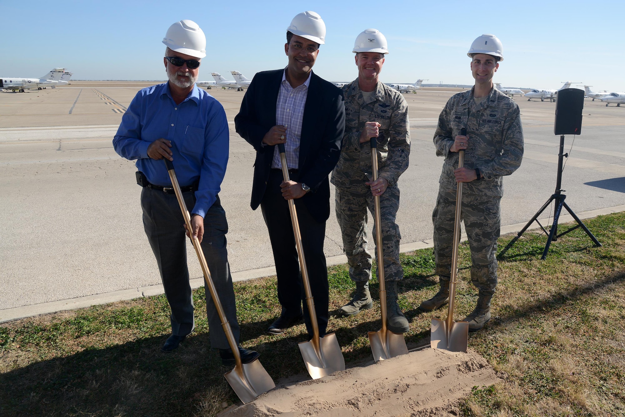 More than 50 Team XL members attended the groundbreaking ceremony for the Laughlin Airfield Drainage Project Feb. 16, 2016. Breaking ground from left to right: Kurt Lemp, Military Affairs Association president; U.S. Rep. Will Hurd, Texas’ 23rd Congressional District congressman; Col. Thomas Shank, 47th Flying Training Wing commander and 1st Lt. Charles Heim, 47th Civil Engineer Squadron officer in charge of project execution. (U.S. Air Force photo by Airman 1st Class Brandon May)