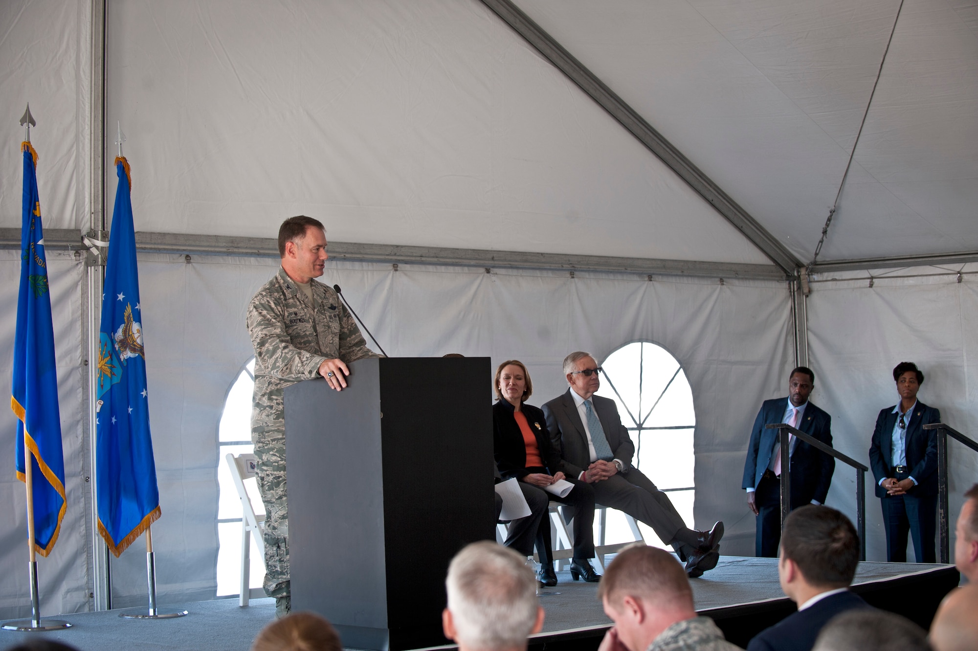 Col. Richard Boutwell, 99th Air Base Wing commander, addresses attendees at the Nellis Solar Array II dedication ceremony Feb. 16, 2016, at Nellis Air Force Base, Nev. The energy generated between the two Nellis AFB solar arrays is approximately 42 percent of the kilowatts per hour needed to power the installation.   (U.S. Air Force photo by Senior Airman Joshua Kleinholz)
