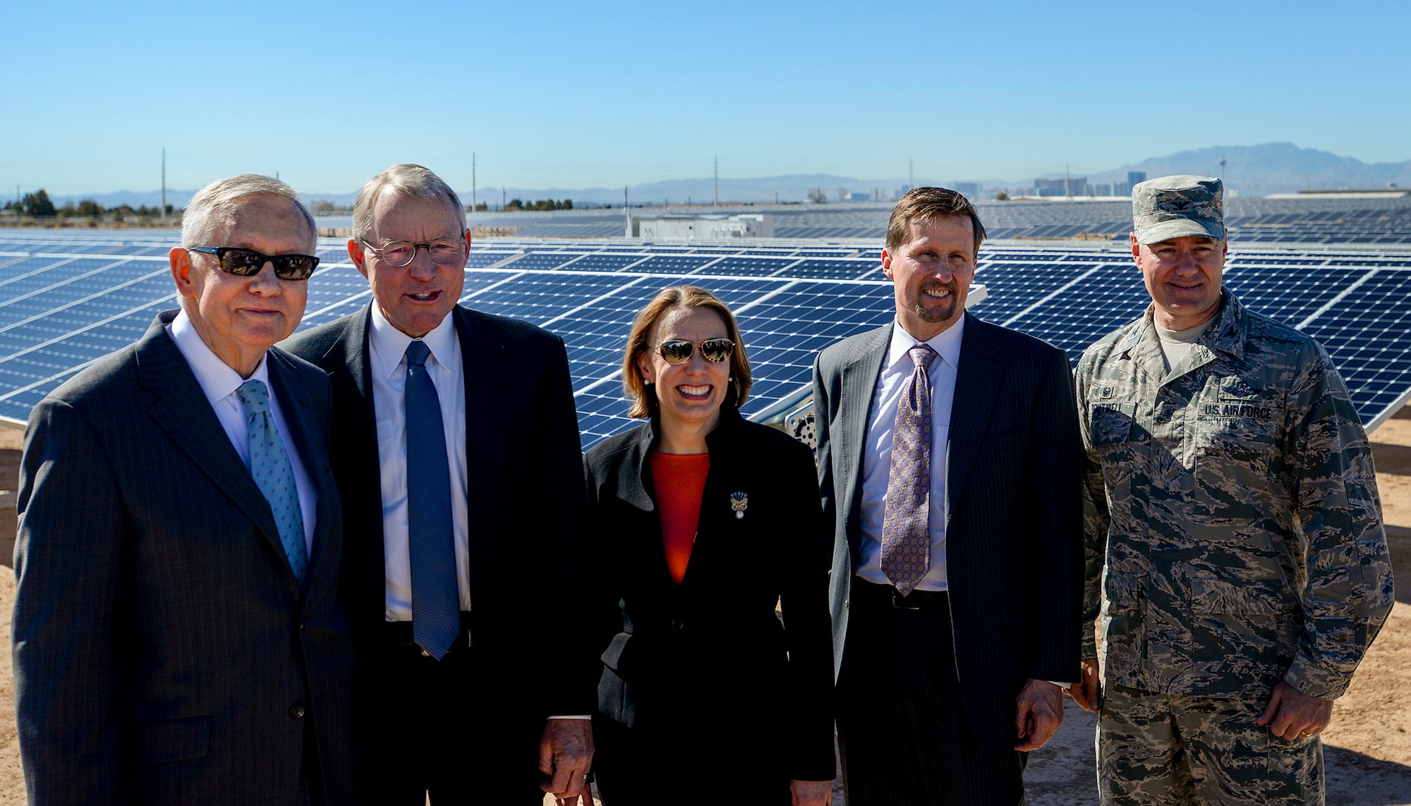 From left to right, Sen. Harry Reid; Paul Caudill, NV Energy CEO; Miranda A.A. Ballentine, Assistant Secretary of the Air Force for Installations, Environment and Energy; Tom Werner, SunPower Corp. CEO; and Col. Richard Boutwell, 99th Air Base Wing commander, pose for a photo at the Nellis Solar Array II Feb. 16, 2016, Nellis Air Force Base, Nev. The U.S. Air Force unveiled the new array during a dedication ceremony on base. (U.S. Air Force photo by Airman 1st Class Kevin Tanenbaum) 