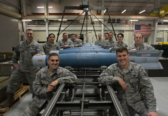 Members from the 366th Equipment Maintenance Squadron and the 57th Maintenance Squadron gather for a group photo after assembling guided bomb unit-12s Paveway IIs, Feb. 8, 2016, at Mountain Home Air Force Base, Idaho. The bomb assembly marked the first time the GBU-12s were assembled for the F-35A Lightning II on Mountain Home AFB. (U.S. Air Force photo by Airman Chester Mientkiewicz/RELEASED) 