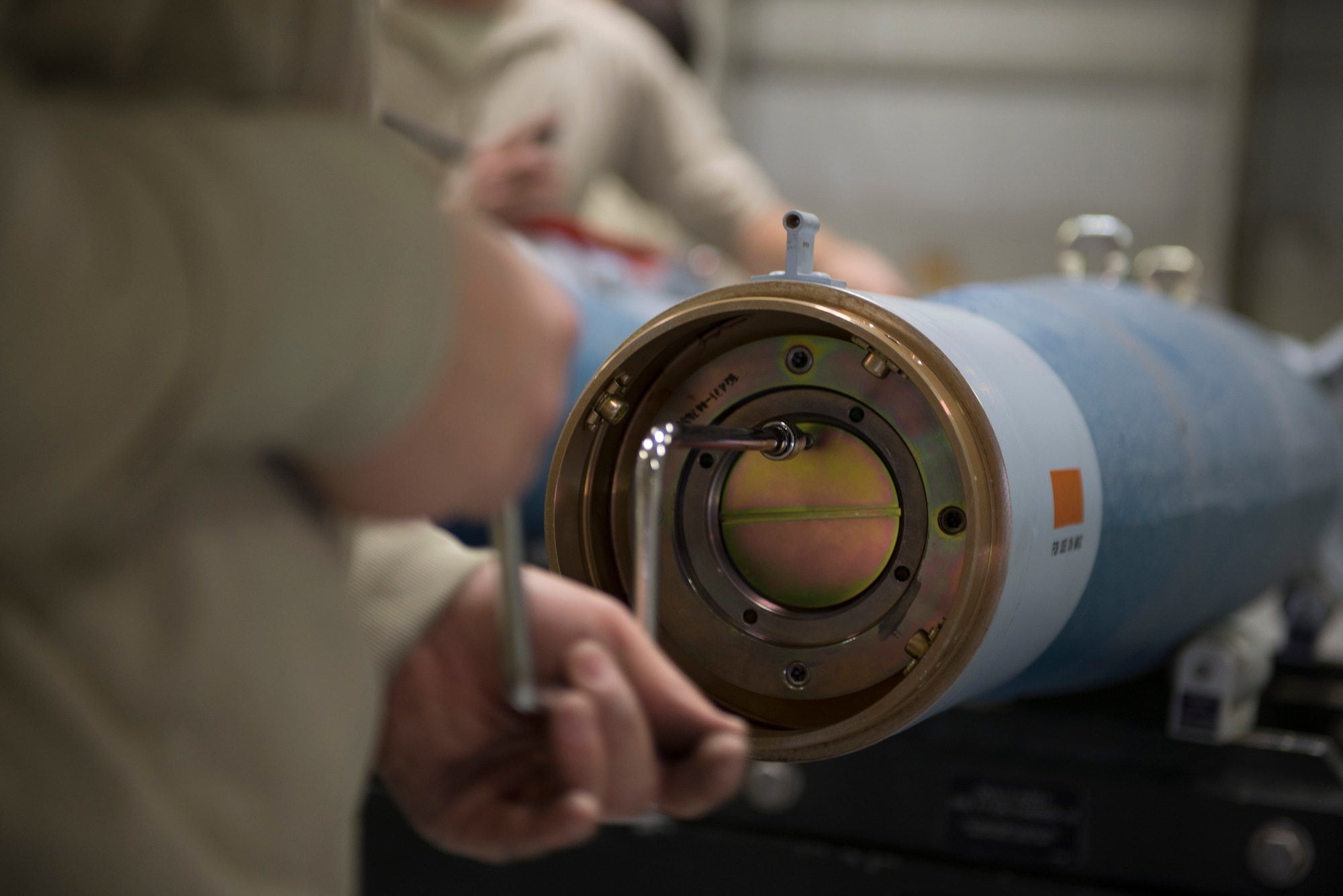 A member from the 366th Equipment Maintenance Squadron assembles a guided bomb unit-12 Paveway II, Feb. 8, 2016, at Mountain Home Air Force Base, Idaho. The GBU-12s were assembled to be used during an initial operating capability test for the F-35A Lightning IIs. (U.S. Air Force photo by Airman Chester Mientkiewicz/RELEASED)