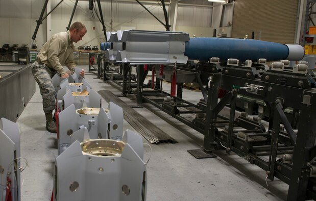Tech. Sgt. Chris Brown, 57th Maintenance Squadron munitions systems craftsman, prepares the tails of the guided bomb unit-12 Paveway IIs for assembly, Feb. 8, 2016, at Mountain Home Air Force Base, Idaho. The GBU-12s were assembled to be used for various training scenarios to assess the deployment capability of the F-35A Lightning II. (U.S. Air Force photo by Airman Chester Mientkiewicz/RELEASED)