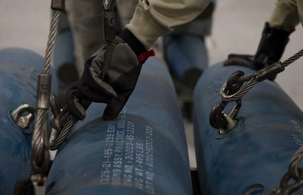 A member of the 366th Equipment Maintenance Squadron monitors three guided bomb unit-12 Paveway IIs to an assembly line, Feb. 8, 2016, at Mountain Home Air Force Base, Idaho. The GBU-12s were assembled to be used during a deployment test for the F-35A Lightning IIs currently underway at Mountain Home AFB. (U.S. Air Force photo by Airman Chester Mientkiewicz/RELEASED)