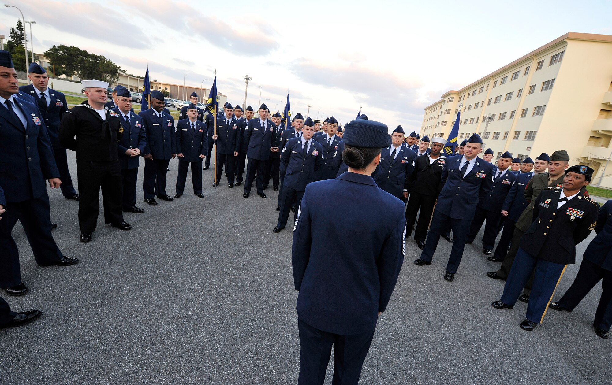 U.S. Air Force Chief Master Sgt. Kristina Rogers, Erwin Professional Military Education commandant, speaks to students from every U.S. branch and Japan Air Self-Defense Force after a service dress uniform inspection, Feb. 9, 2016, at Kadena Air Base, Japan. The PME center, which routinely educates JASDF and sister service NCOs, operates the exchange program in order to build a stronger joint and coalition team. (U.S. Air Force photo by Naoto Anazawa)