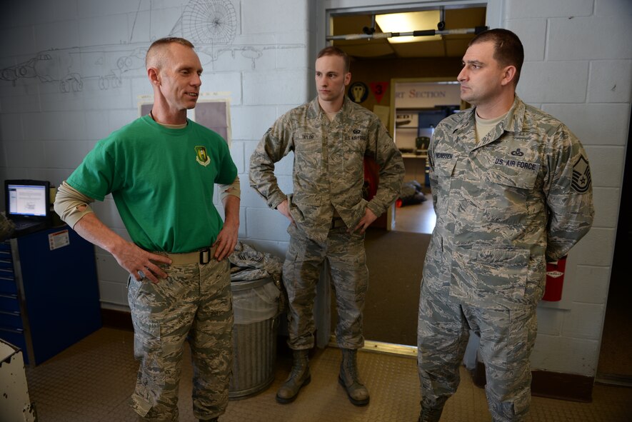 Chief Master Sgt. Geoff Weimer, 5th Bomb Wing command chief, visits with Airmen from the 5th Operations Support Squadron’s Aircrew Flight Equipment unit at Minot Air Force Base, N.D., Feb. 12, 2016. AFE inspects, repairs and maintains all personnel and their survival gear during flight, descent and survival situations. This equipment includes but is not limited to helmets, masks, survival kits, survival vest, parachutes, life rafts, life preservers, anti-exposure suits, night vision goggles and aircrew chemical biological equipment. (U.S. Air Force photo/Airman 1st Class Jessica Weissman)
