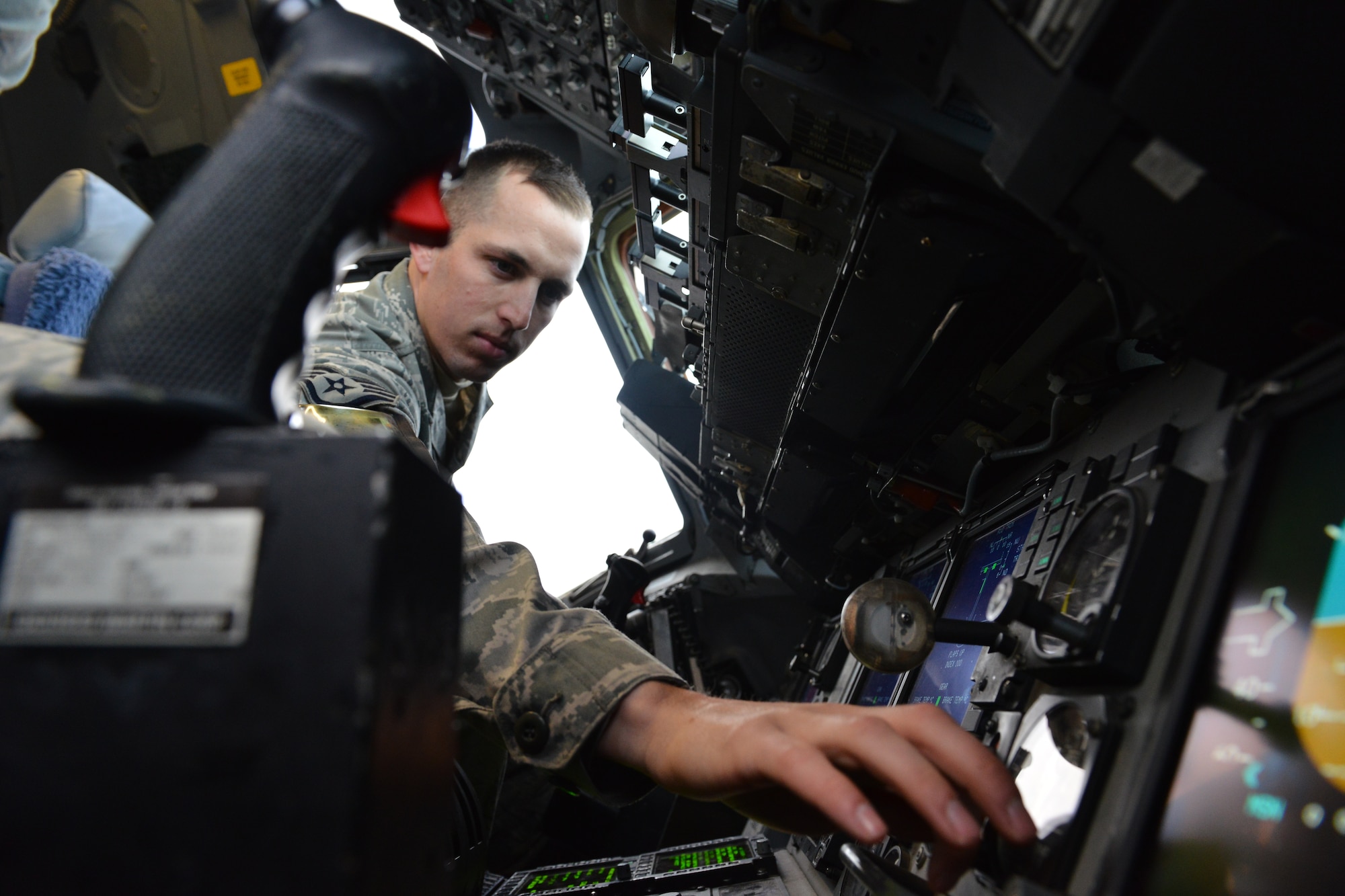 Air Force Staff Sgt. Adam Edmunds, an instrument flight control system journeyman assigned to the 517th Airlift Squadron, performs preparation tasks for an air data comparison check in a C-17 Globemaster II Feb. 11 on the Joint Base Elmendorf-Richardson flightline. As an instrument flight controls avionics Airman, Edmunds is responsible for ensuring the proper working order of a large number of equipment essential for flight. (U.S. Air Force photo by Airman 1st Class Kyle Johnson)