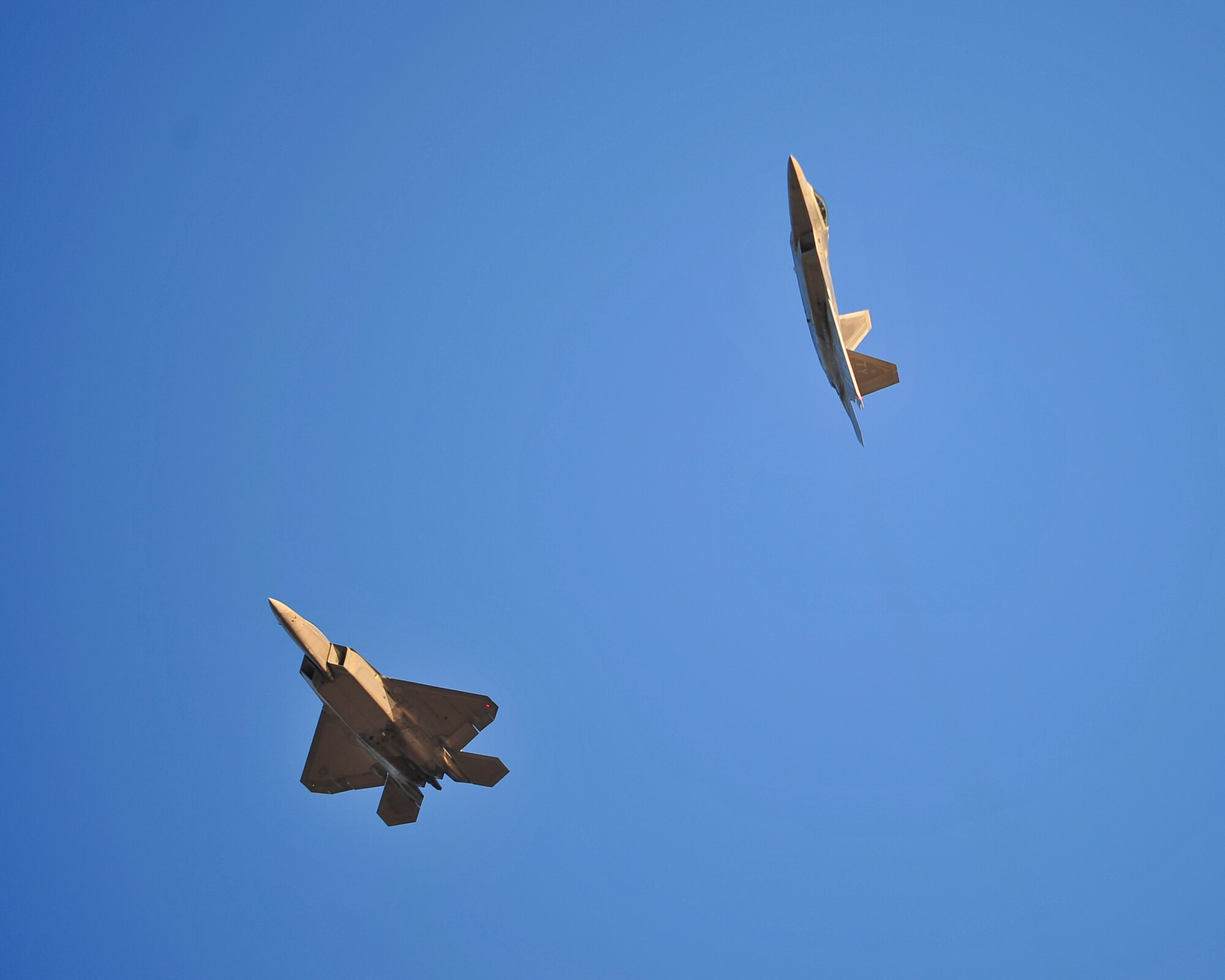 Two F-22 Raptors fly over Tyndall Air Force Base, Fla., after their return from Red Flag 16-1 Feb. 13, 2016. During the Red Flag 16-1 exercise, 1,911 sorties were flown with 125 aircraft. Out of those sorties, 205 came from the 95th Fighter Squadron and 95th Aircraft Maintenance Unit. (U.S. Air Force photo by Senior Airman Dustin Mullen/Released)