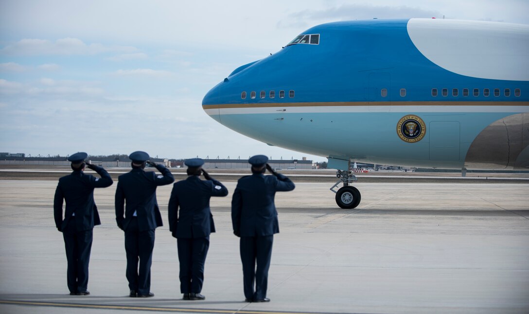 Airmen salute Air Force One on the flightline at Joint Base Andrews, Md., Feb. 10, 2016. The Boeing VC-25 that is labelled Air Force One when the president is aboard is assigned to JBA. (U.S. Air Force photo by Airman 1st Class Philip Bryant/Released)