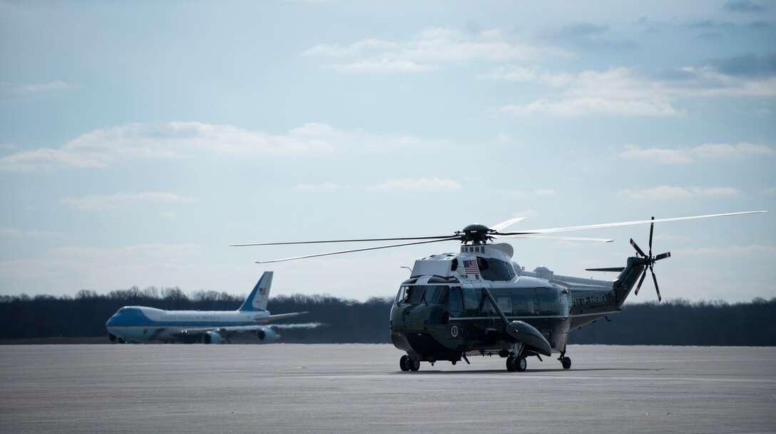 Air Force One prepares to take off as the Sikorsky SH-3 Sea King that flew President Barack Obama to Joint Base Andrews, Md., sits on the flightline Feb. 10, 2016. The Boeing VC-25 that is labelled Air Force One when the president is aboard is assigned to JBA. (U.S. Air Force photo by Airman 1st Class Philip Bryant/Released)