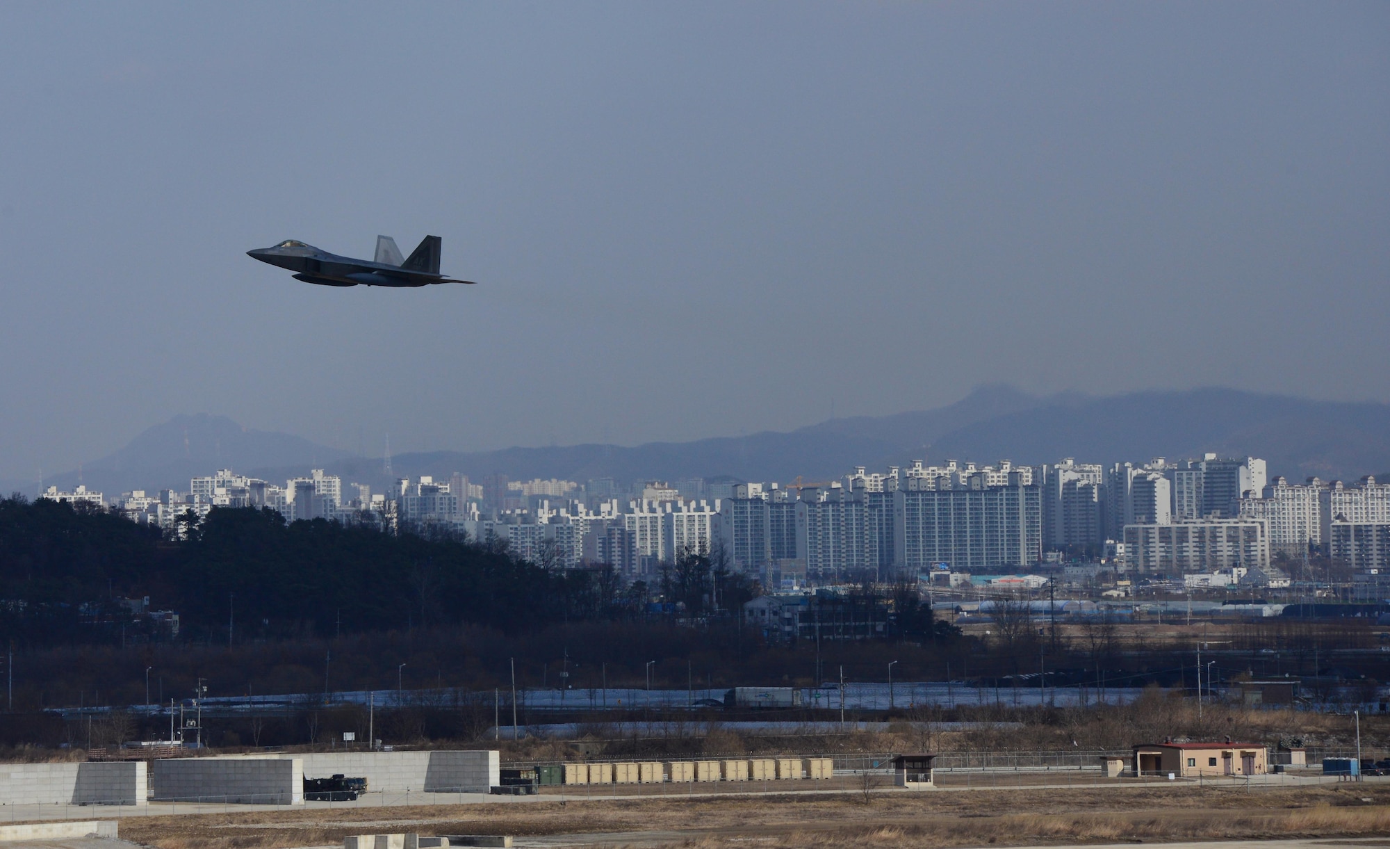 A U.S. Air Force F-22 Raptor from Kadena Air Base, Japan, conducted a flyover in the vicinity of Osan Air Base, South Korea, in response to recent provocative action by North Korea Feb. 17, 2016. Four Raptors were joined by South Korean F-15K Slam Eagles and U.S. Air Force F-16 Fighting Falcons. The F-22 is designed to project air dominance rapidly and at great distances and currently cannot be matched by any known or projected fighter aircraft. (U.S. Air Force photo by Staff Sgt. Amber Grimm/Released)
