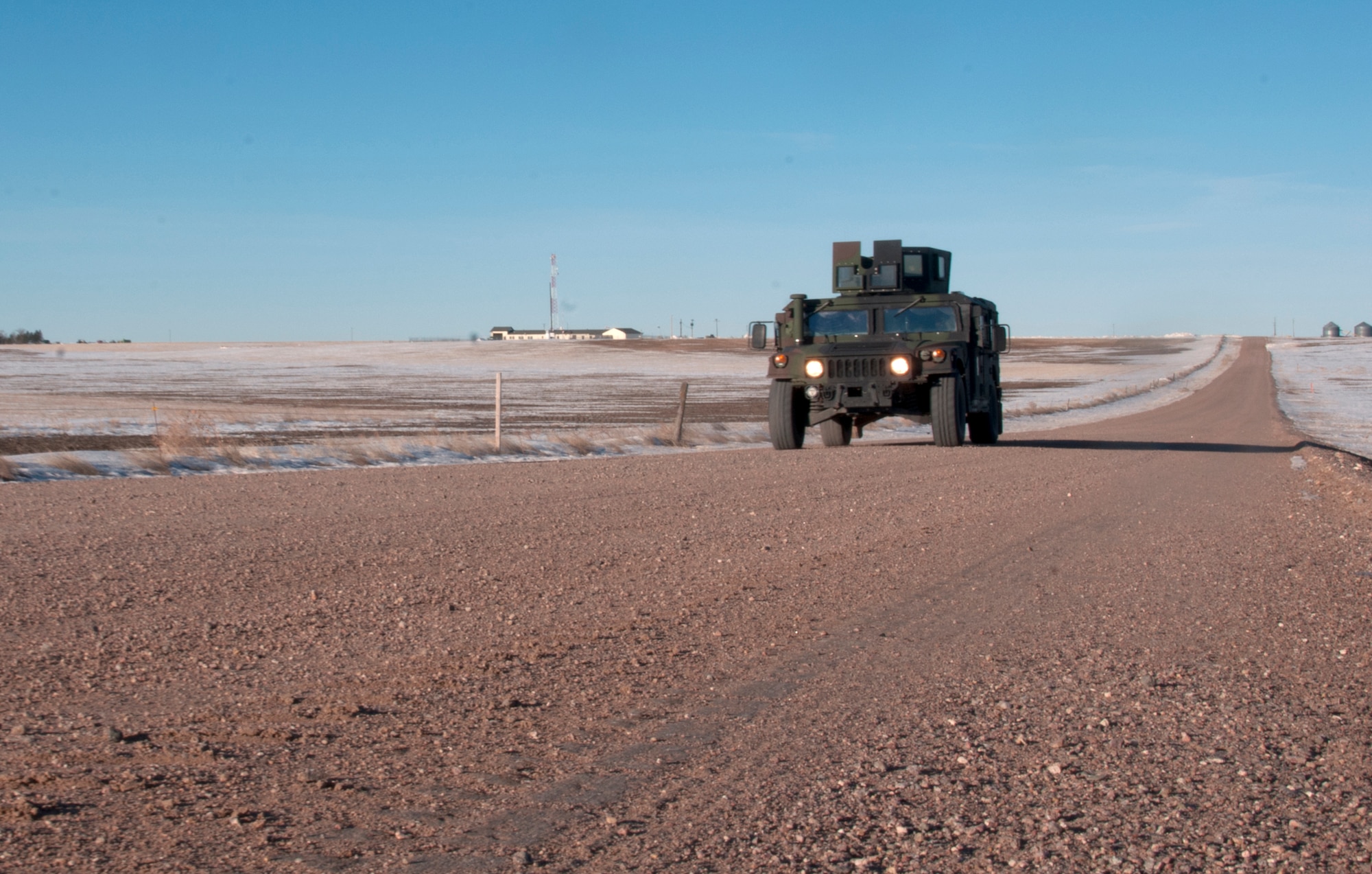 A 90th Missile Security Force Squadron Humvee patrols in the F.E. Warren Air Force Base, Wyo., missile complex Feb. 9, 2016, A Simulated Electronic Launch-Minuteman test was conducted that day. (U.S. Air Force photo by Senior Airman Jason Wiese)