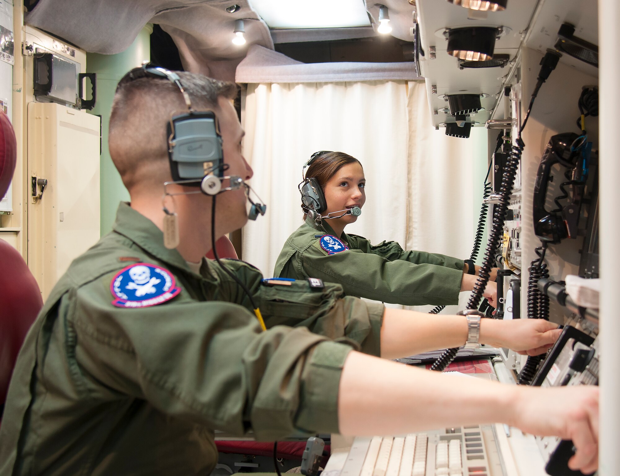 First Lt. Pamela Blanco-Coca, 319th Missile Squadron missile combat crew commander, and her deputy commander, 2nd Lt. John Anderson, simulate key turns of the Minuteman III Weapon System Feb. 9, 2016, in a launch control center in the F.E. Warren Air Force Base, Wyo., missile complex. When directed by the U.S. President a properly conducted key turn sends a launch vote to any number of Minuteman III ICBMs in a missileer's squadron, with two different launch votes enabling a launch. (U.S. Air Force photo by Senior Airman Jason Wiese)