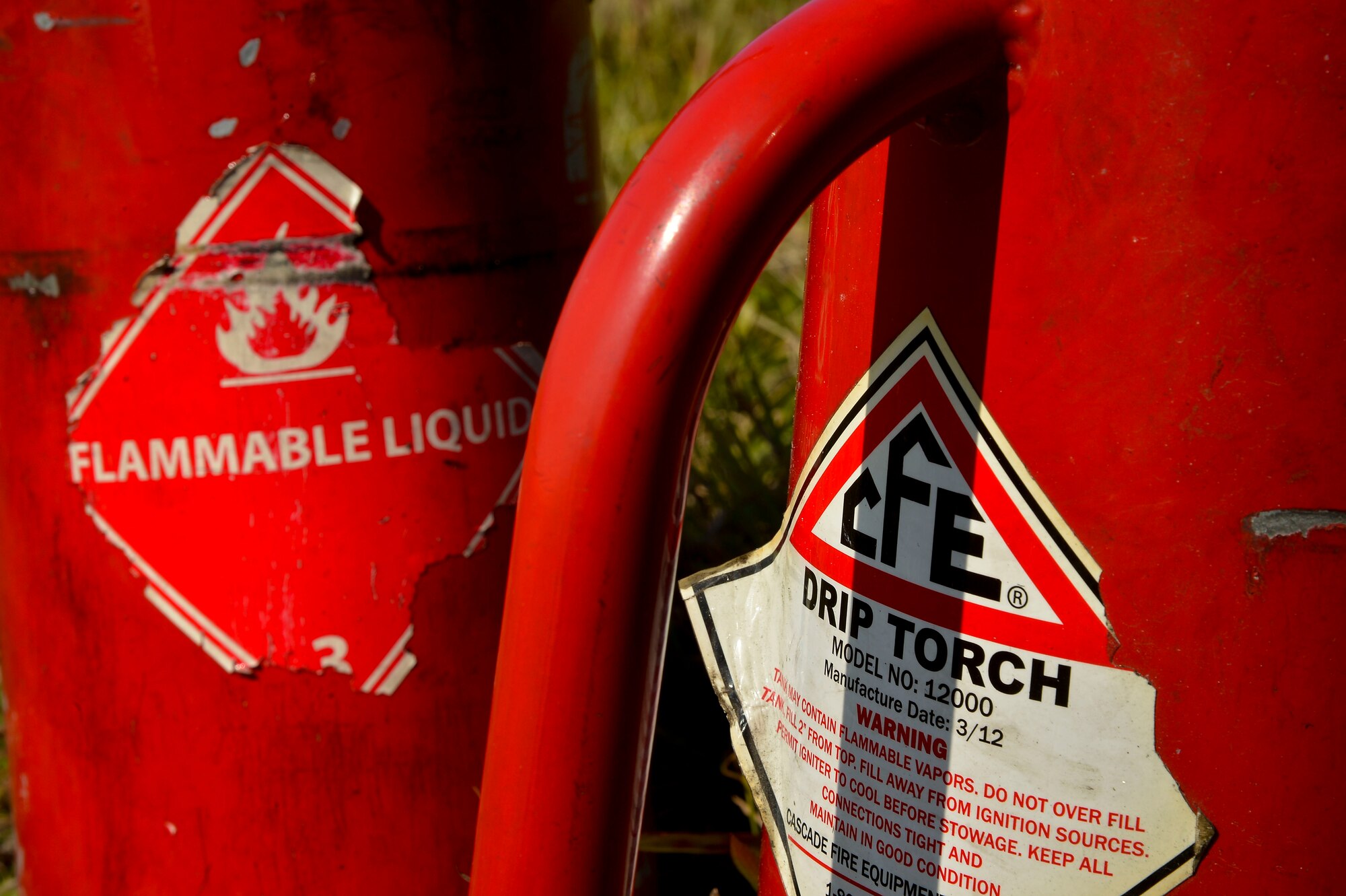 Firefighters assigned to the 6th Civil Engineer Squadron and members of the Air Force Wildland Fire Center use drip torches to ignite a site during a prescribed burn at MacDill Air Force Base, Fla., Feb. 13, 2016. Although drip torches are necessary to start the fires, weather was essential in determining what the fire would do throughout the burn. (U.S. Air Force photo by Staff Sgt. Shandresha Mitchell)