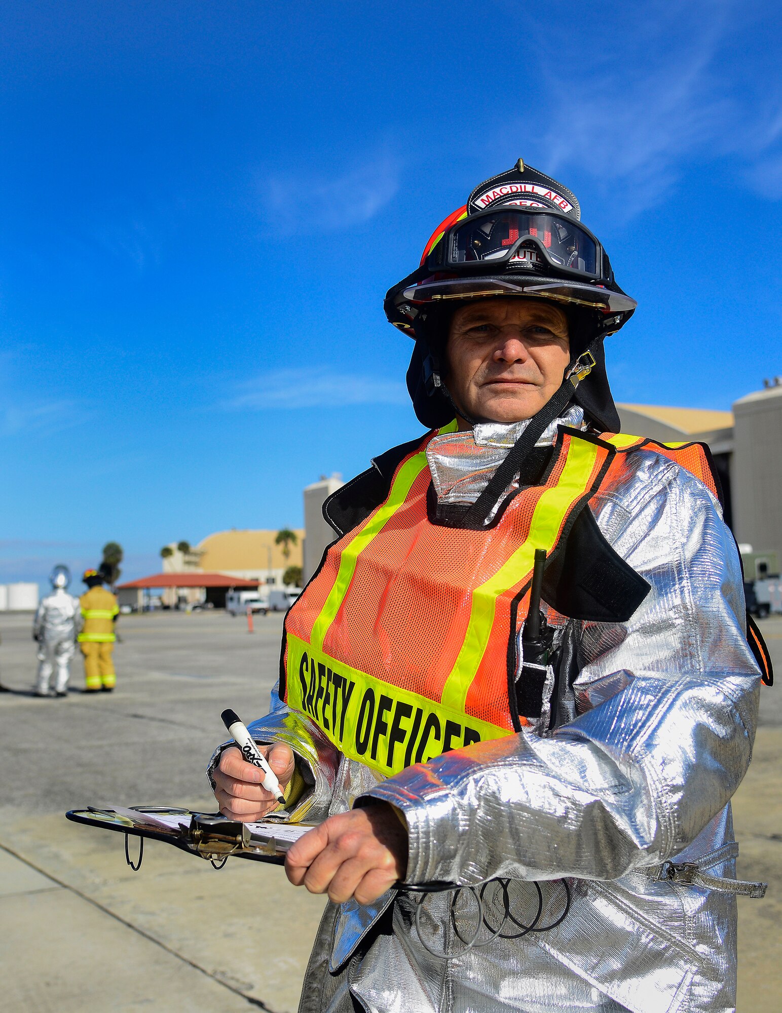 Todd Bute, assigned to the 6th Civil Engineer Squadron, evaluates firefighters during a major accident response exercise (MARE) at MacDill Air Force Base, Fla., Feb. 8, 2016. The MARE evaluated MacDill’s first responders’ ability to safely handle a simulated aircraft crash on the flightline. (U.S. Air Force photo by Staff Sgt. Melanie Hutto) 