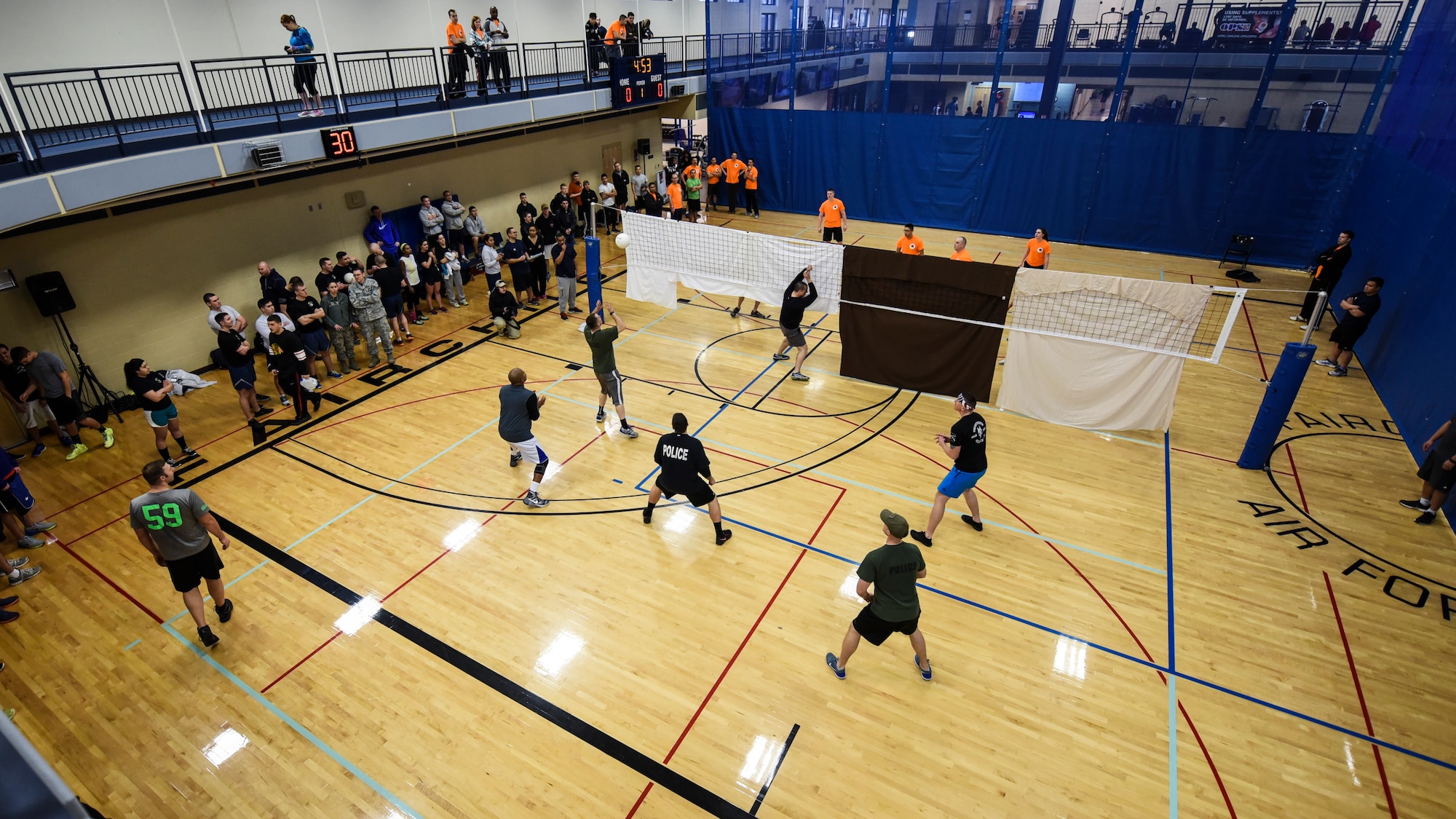 Airmen from various squadrons compete in a blind volleyball game during Winter Sports Day Feb. 12, 2016, at Fairchild Air Force Base, Wash. Winter Sports Day serves as a day for the wing to get together, play sports and stay fit. (U.S. Air Force Photo/Airman 1st Class Mackenzie Richardson) 