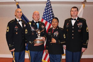 (From left) U.S. Army Master Sgt. Matthew Calhoun, U.S. Army Recruiting Command senior career counselor, Sgt. 1st Class Justin D. Puls, 5th Recruiting Brigade senior career counselor, U.S. Army Sgt. Maj. Cielito Pascual-Jackson, Headquarter Training and Doctrine Command’s Command Career Counselor, and U.S. Army Sgt. 1st Class Robert Woods II, USAREC senior ops noncommissioned officer, stand for a photo after the TRADOC Career Counselor of the Year Competition at Fort Eustis, Jan. 28, 2016. (Courtesy photo)