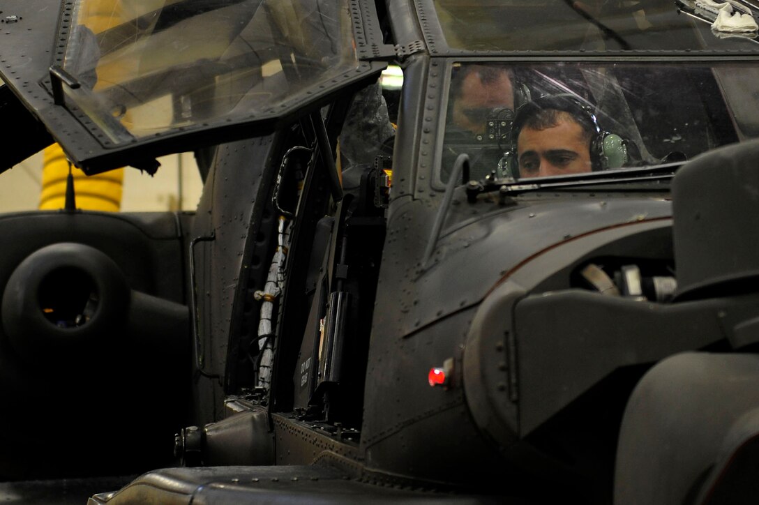 U.S. Army Spc. Dominic Freitas, a student with 128th Aviation Brigade, 1st Battalion, 222nd Aviation Regiment, waits for instruction during an armament, electronic and avionics systems repair course at Fort Eustis, Va., Feb. 11, 2016. Although the students are not taught how to fly a Boeing AH-64 Apache, they learn how to replace the parts on the aircraft. (U.S. Air Force photo by Airman 1st Class Breonna Veal)