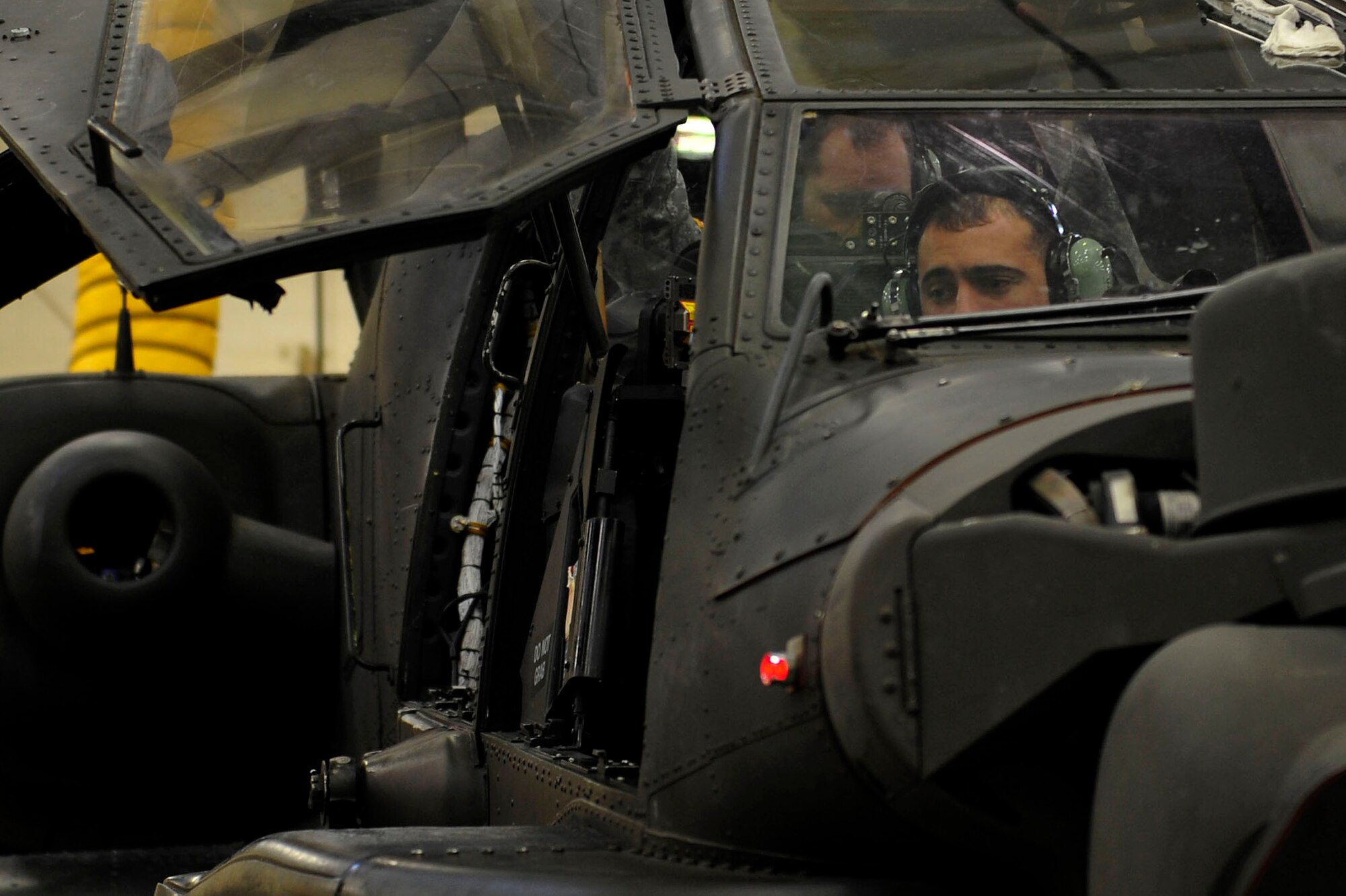 U.S. Army Spc. Dominic Freitas, a student with 128th Aviation Brigade, 1st Battalion, 222nd Aviation Regiment, waits for instruction during an armament, electronic and avionics systems repair course at Fort Eustis, Va., Feb. 11, 2016. Although the students are not taught how to fly a Boeing AH-64 Apache, they learn how to replace the parts on the aircraft. (U.S. Air Force photo by Airman 1st Class Breonna Veal)