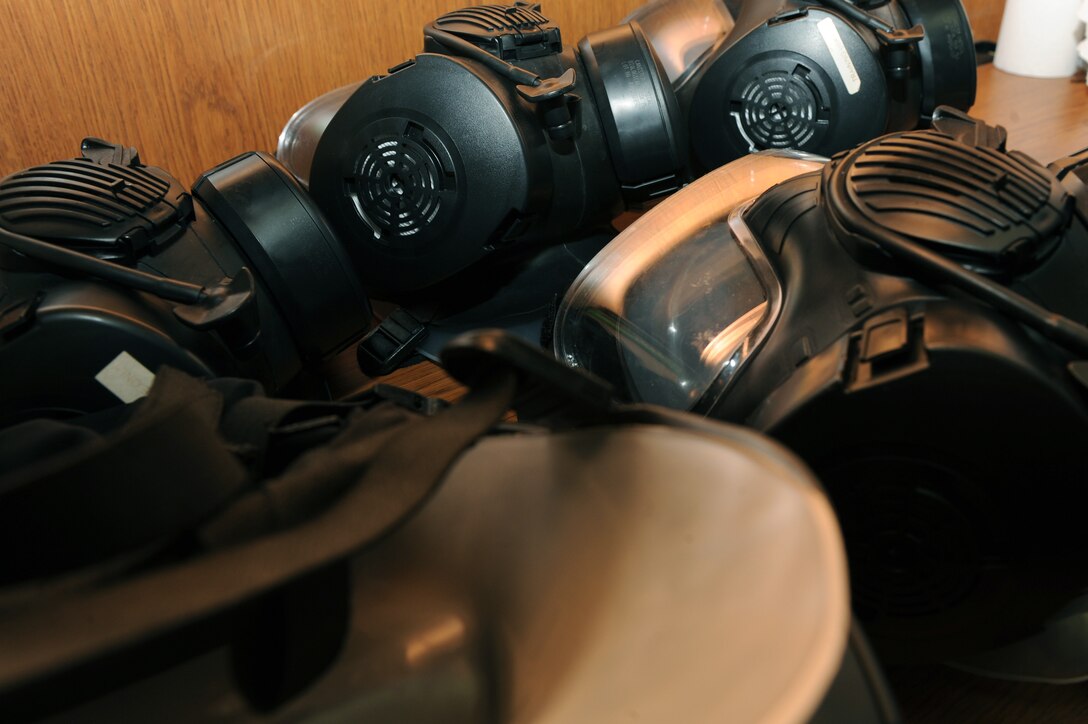 M-50 gas masks prepare to be prepped for fit testing at the 633rd Aerospace Medicine Squadron bioenvironmental office at Langley Air Force Base, Va., Feb. 9, 2016. Bioenvironmental conduct gas mask fit tests for U.S. Service members, ensuring they have a tight seal in the event of chemical warfare in a deployed environment. (U.S. Air Force photo by Senior Airman Brittany E. N. Murphy)