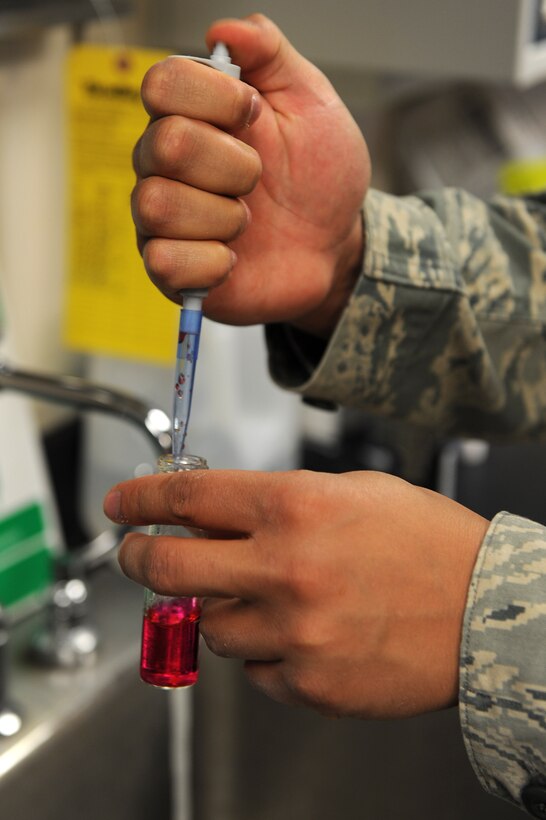 U.S Air Force Airman Alex McClendon, 633rd Aerospace Medicine Squadron bioenvironmental engineer technician, tests a water sample for potential hydrogen at Langley Air Force Base, Va., Feb. 9, 2016. Bioenvironmental Airmen conduct air, water, noise and radiation sampling for numerous facilities around the base. (U.S. Air Force photo by Senior Airman Brittany E. N. Murphy)